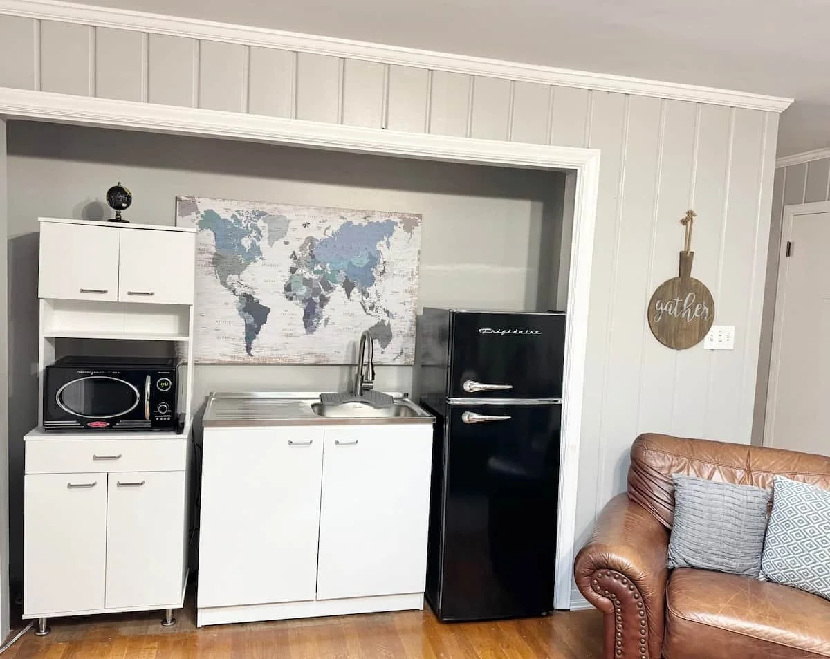 Compact kitchen with cooktop, mini fridge and Keurig coffee station