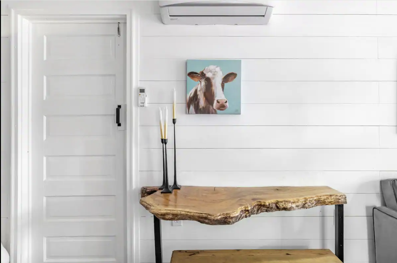 Inviting living area with shiplap walls and comfortable seating