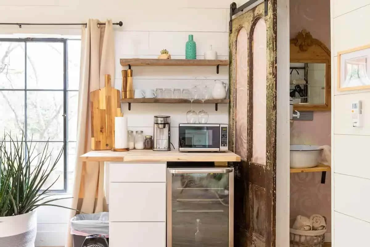 Small kitchenette area with coffee maker, microwave and mini-fridge