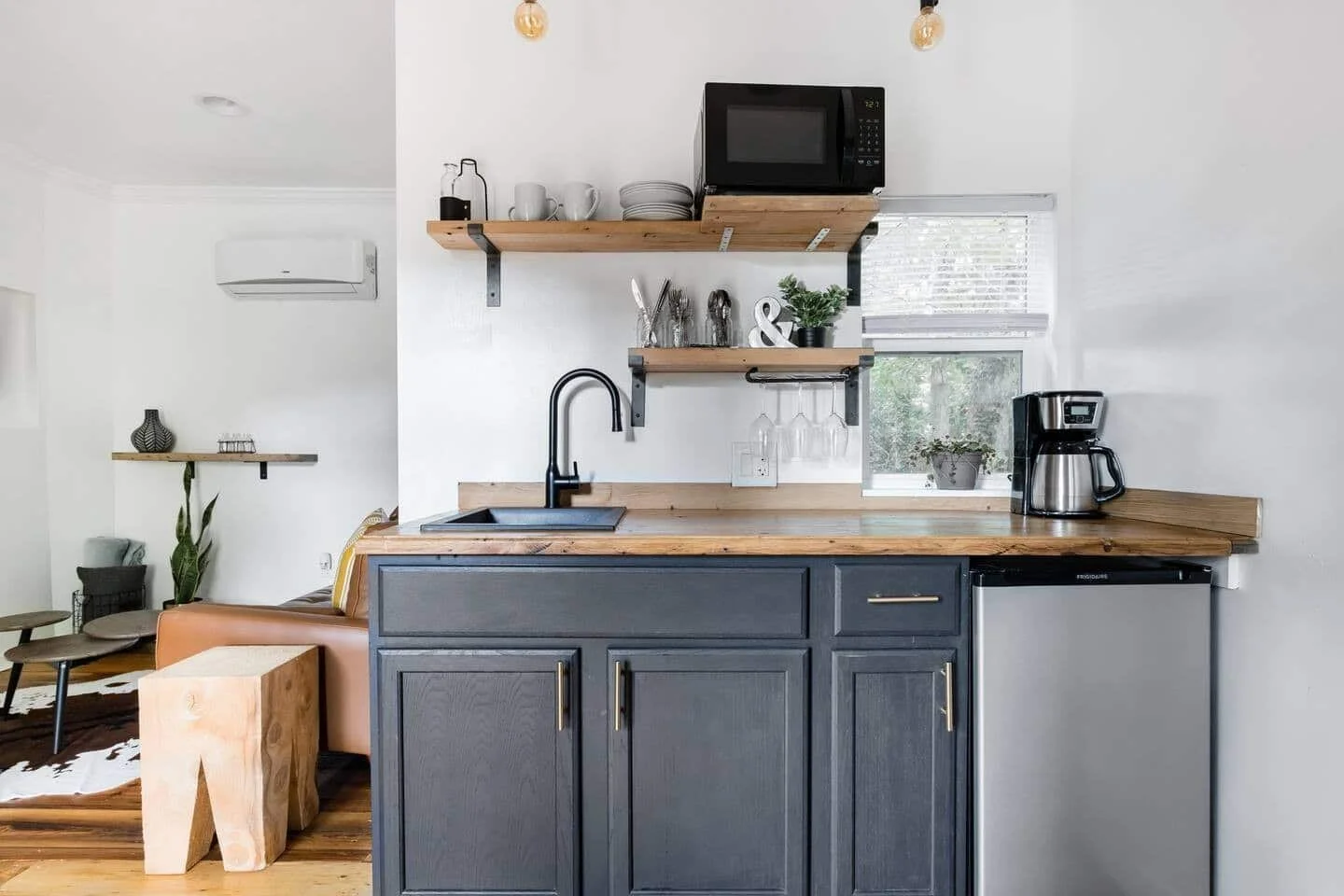 Compact kitchen with reclaimed oak countertops and Keurig coffee station
