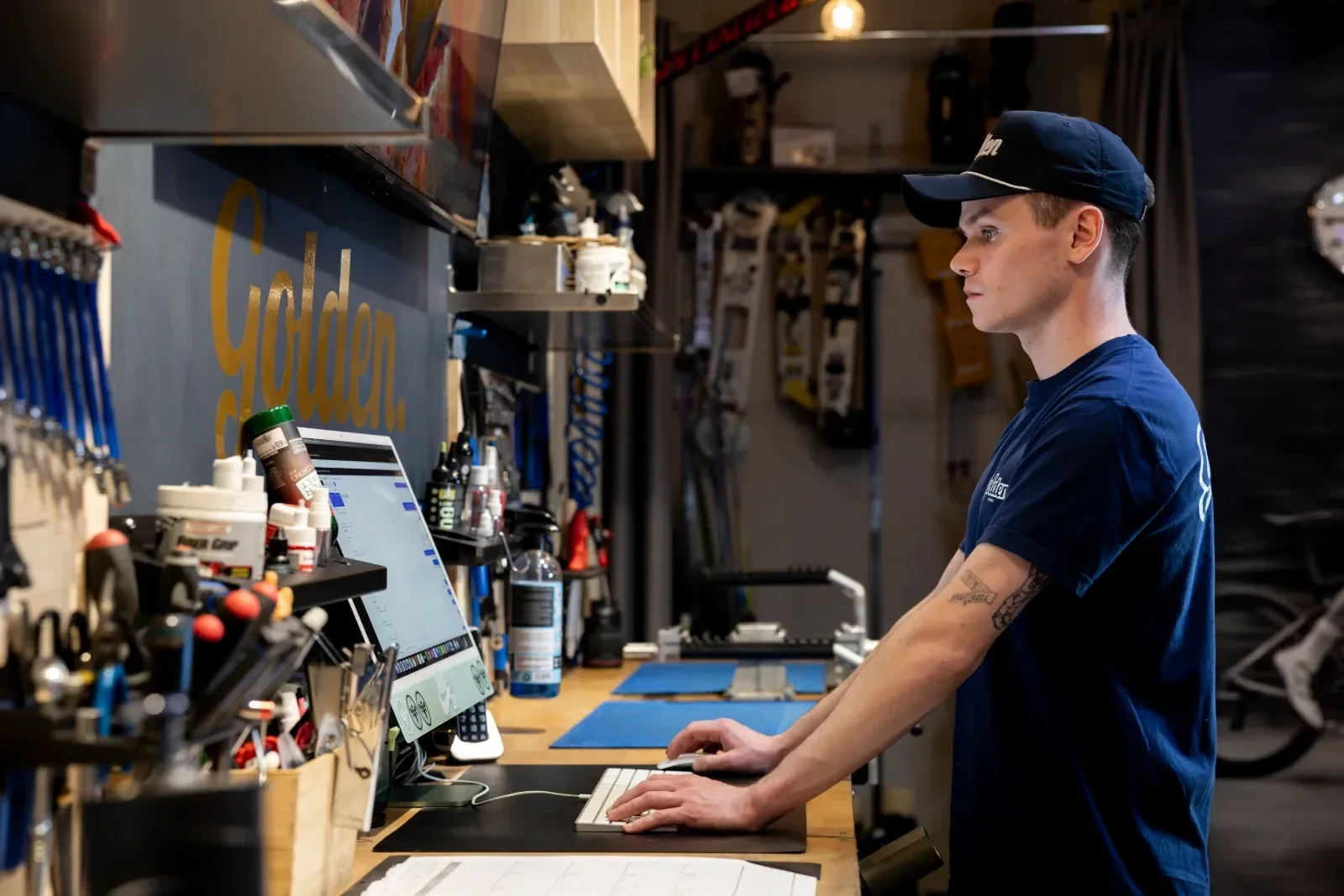 Shop employee working at a computer in a bike shop