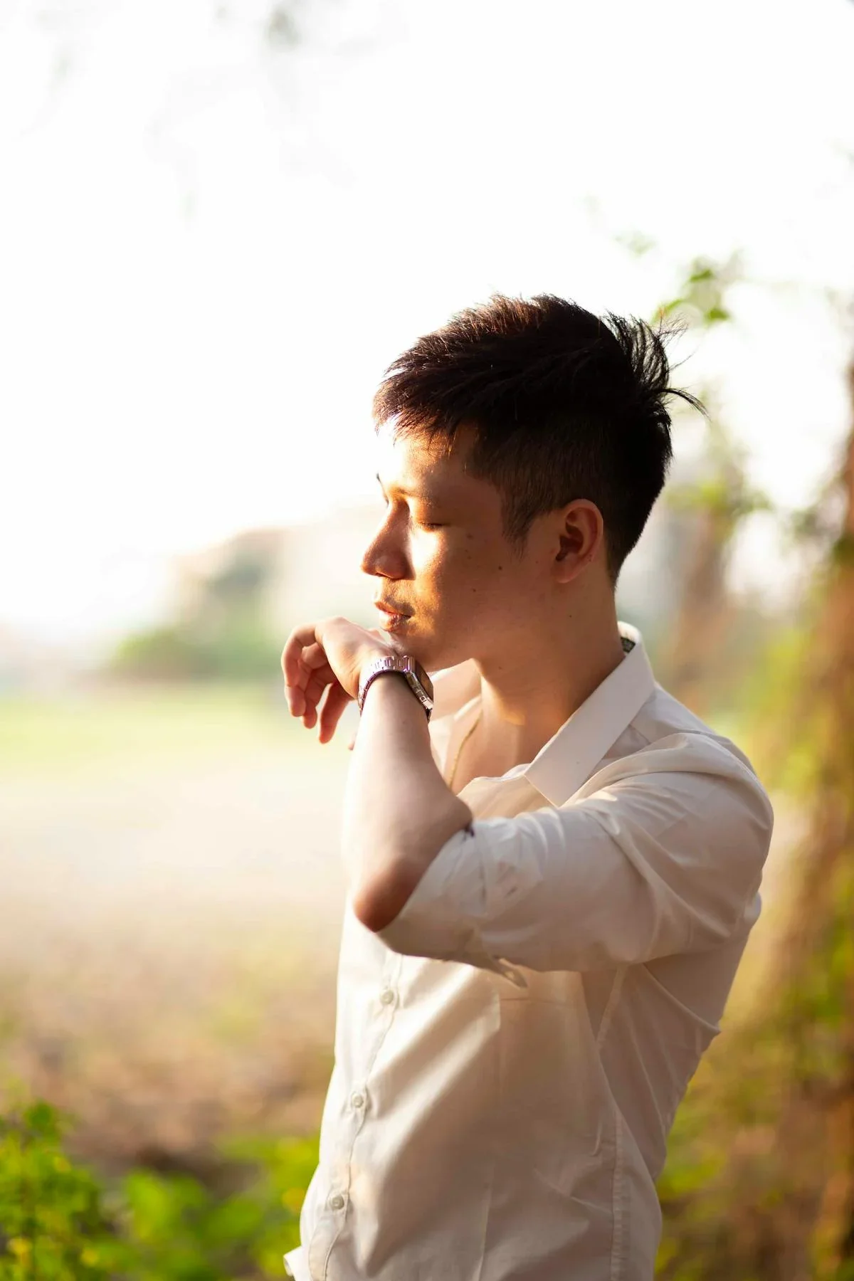 Man in contemplative moment outdoors — vitality, drive, and focus through BHRT