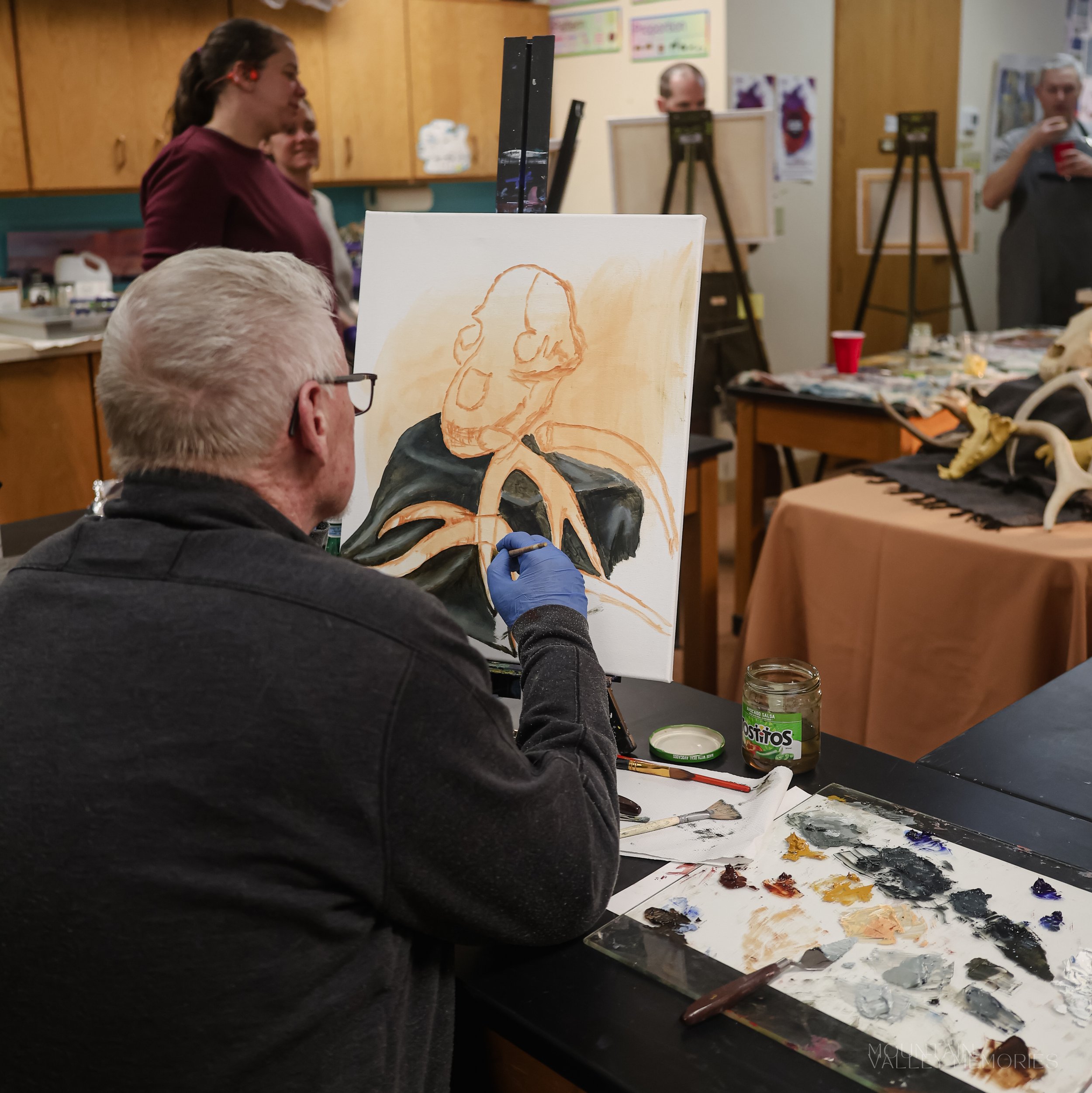 Adults at work during a class in the LAC classroom
