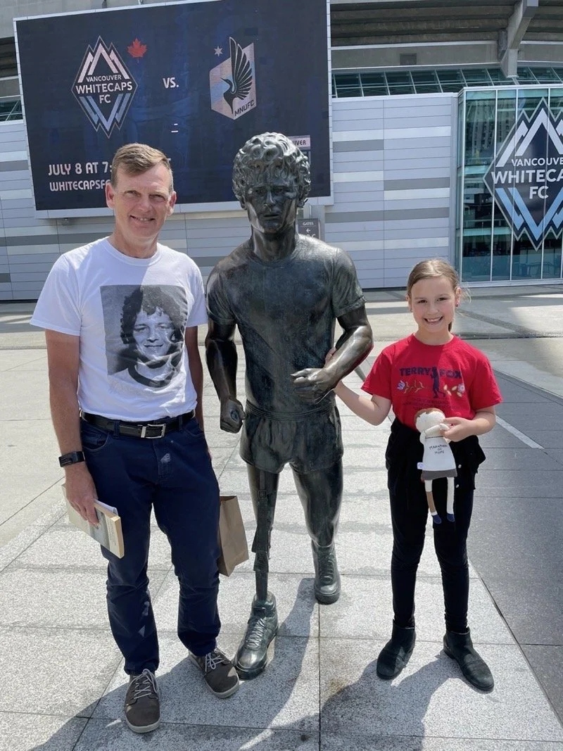 Emilie with Darrell Fox at the Terry Fox statue outside BC Place
