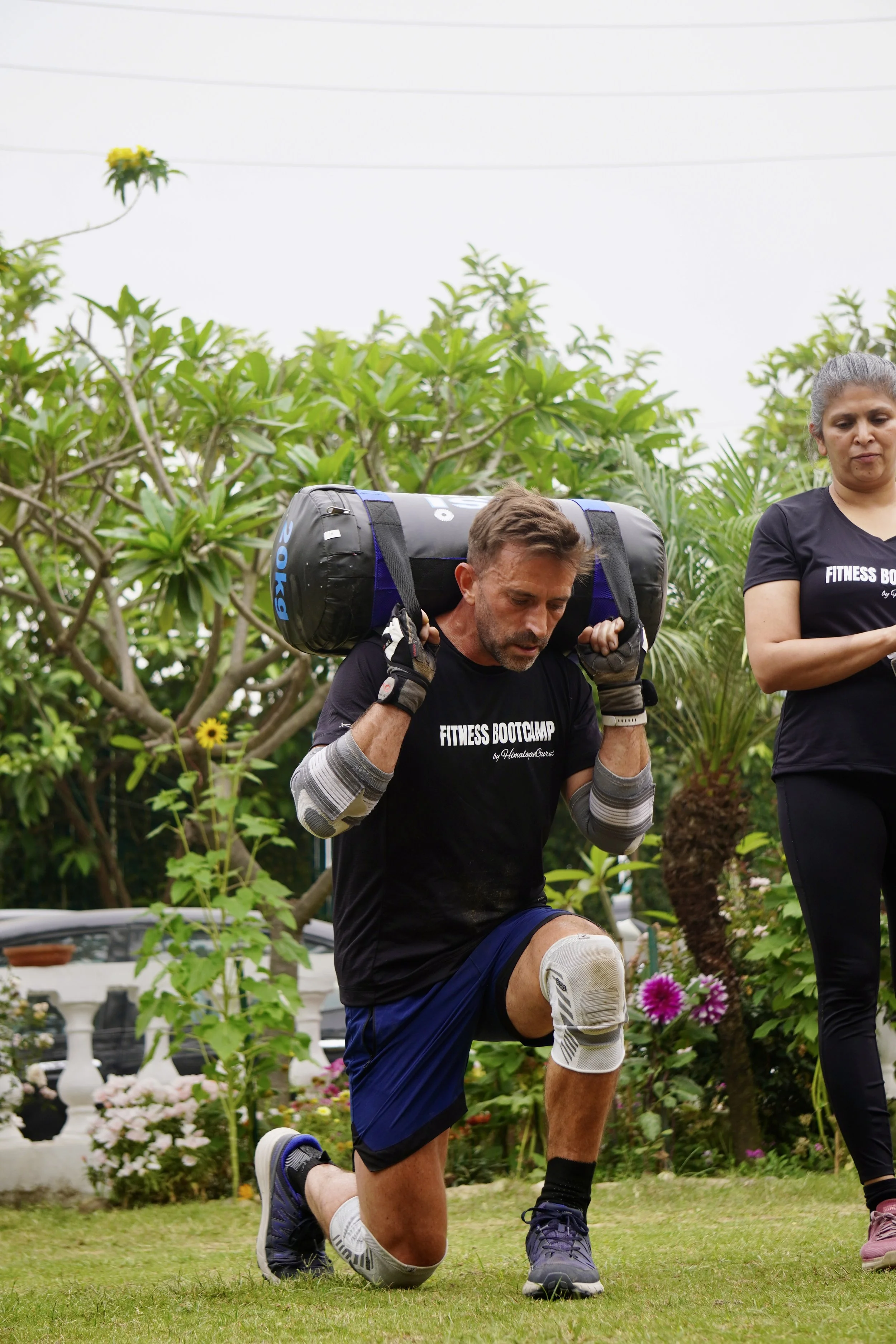 Robert Townson training sandbag lunges at Fitness Bootcamp, Rishikesh