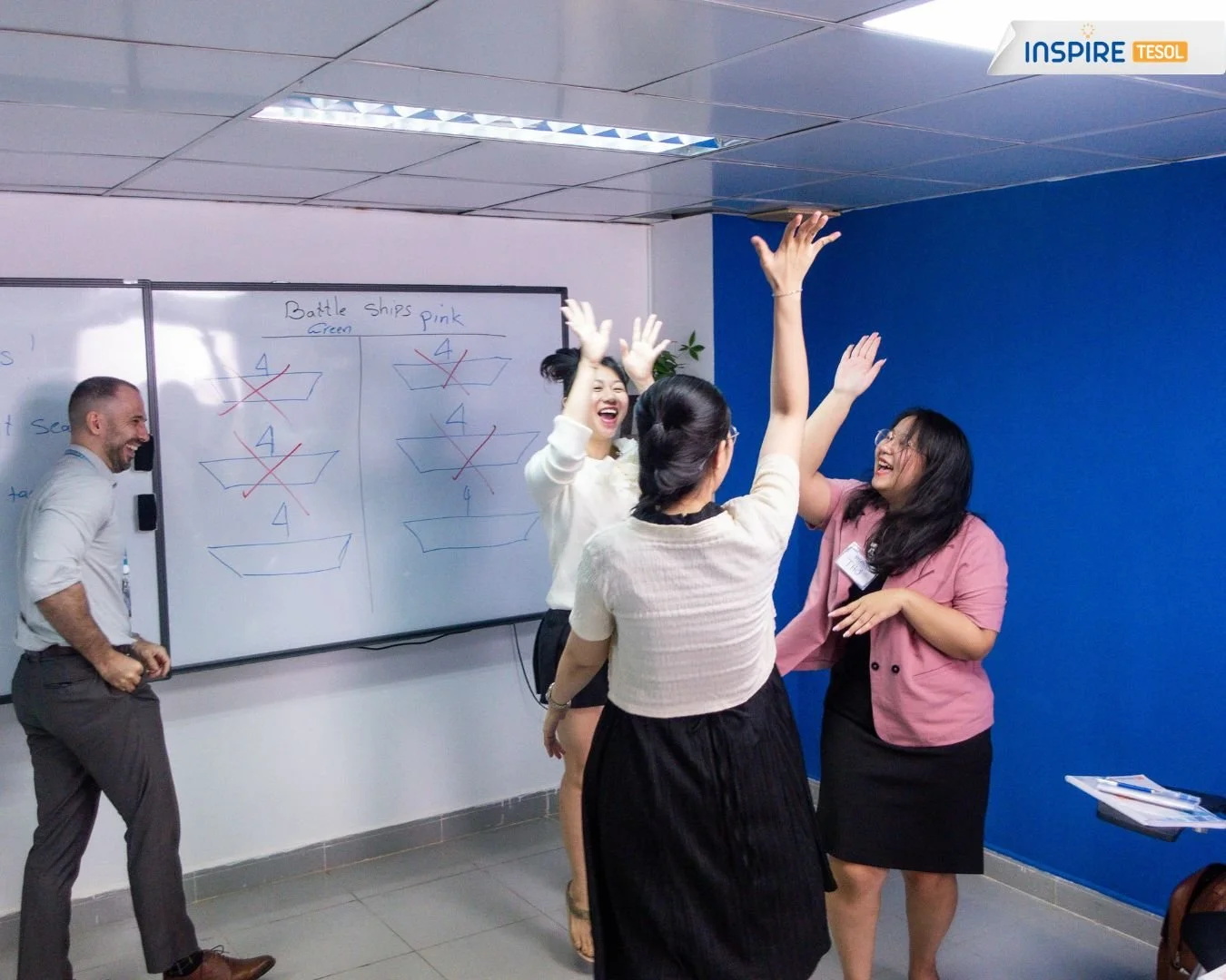 Teacher leading an active ESL classroom activity