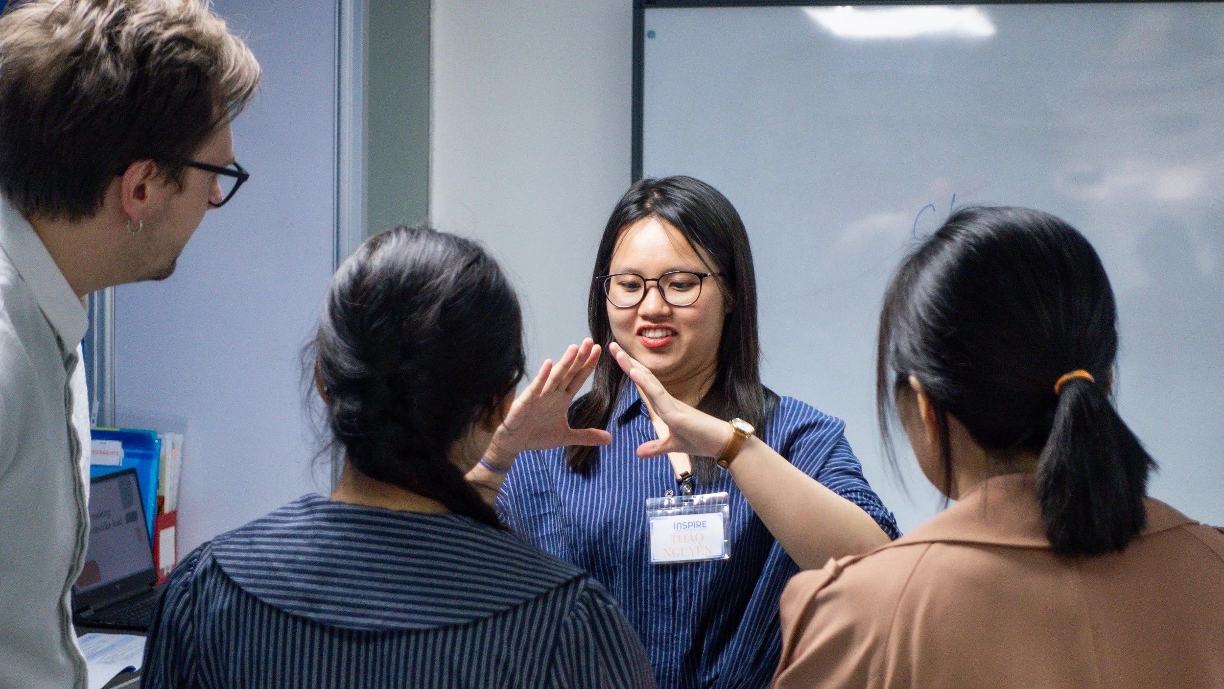 ESL students participating in an interactive classroom lesson