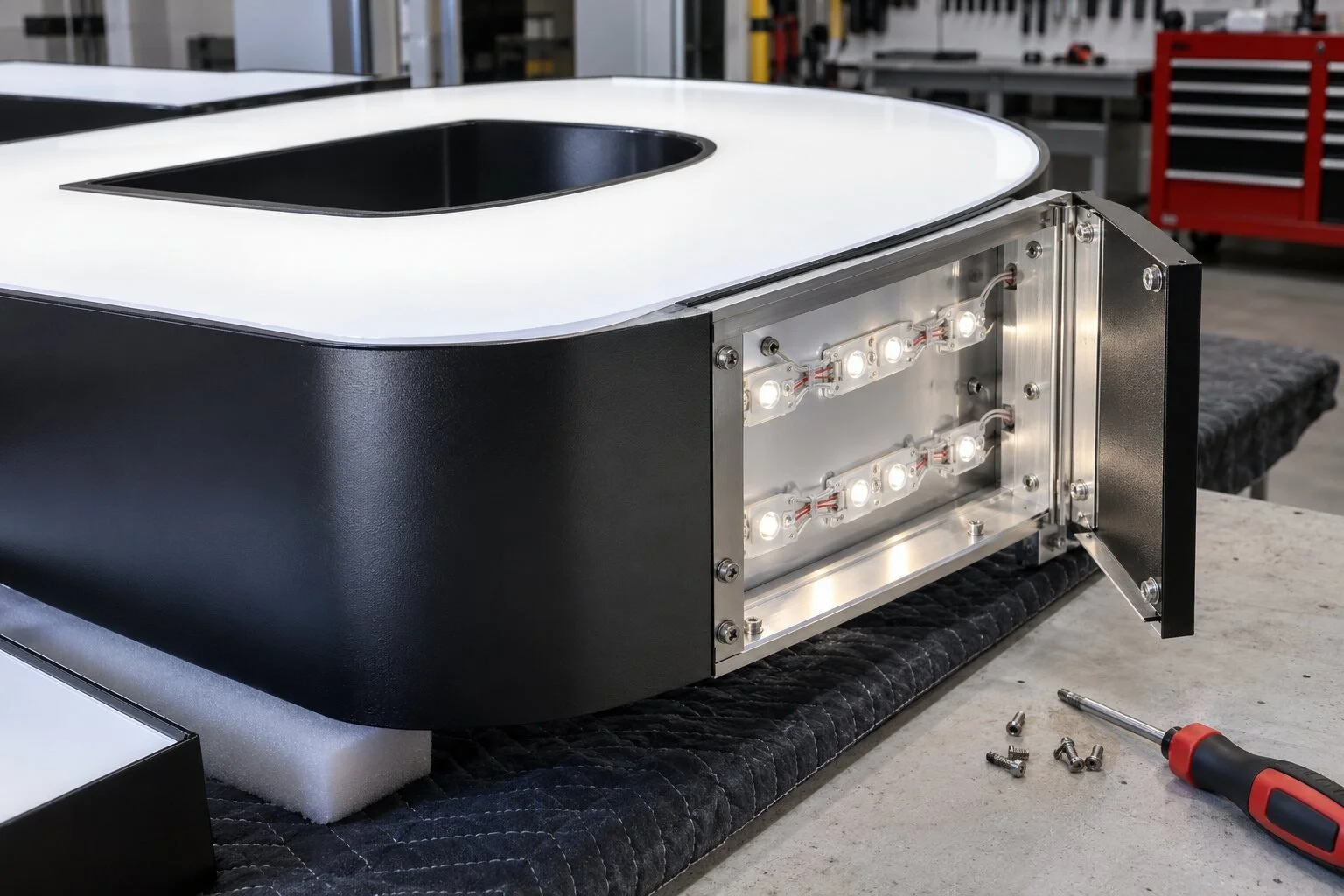 Close fabrication detail of an illuminated cabinet sign with serviceable LED modules