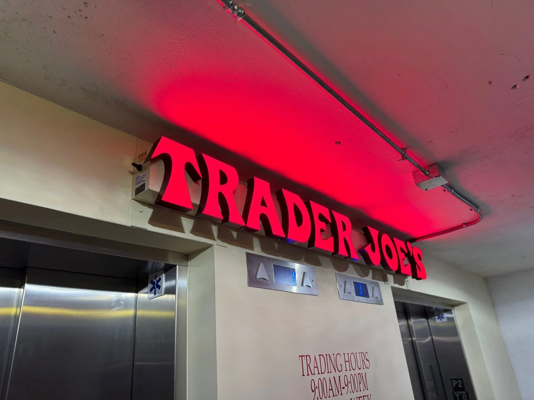 Trader Joe’s illuminated dimensional letters installed over an interior entrance