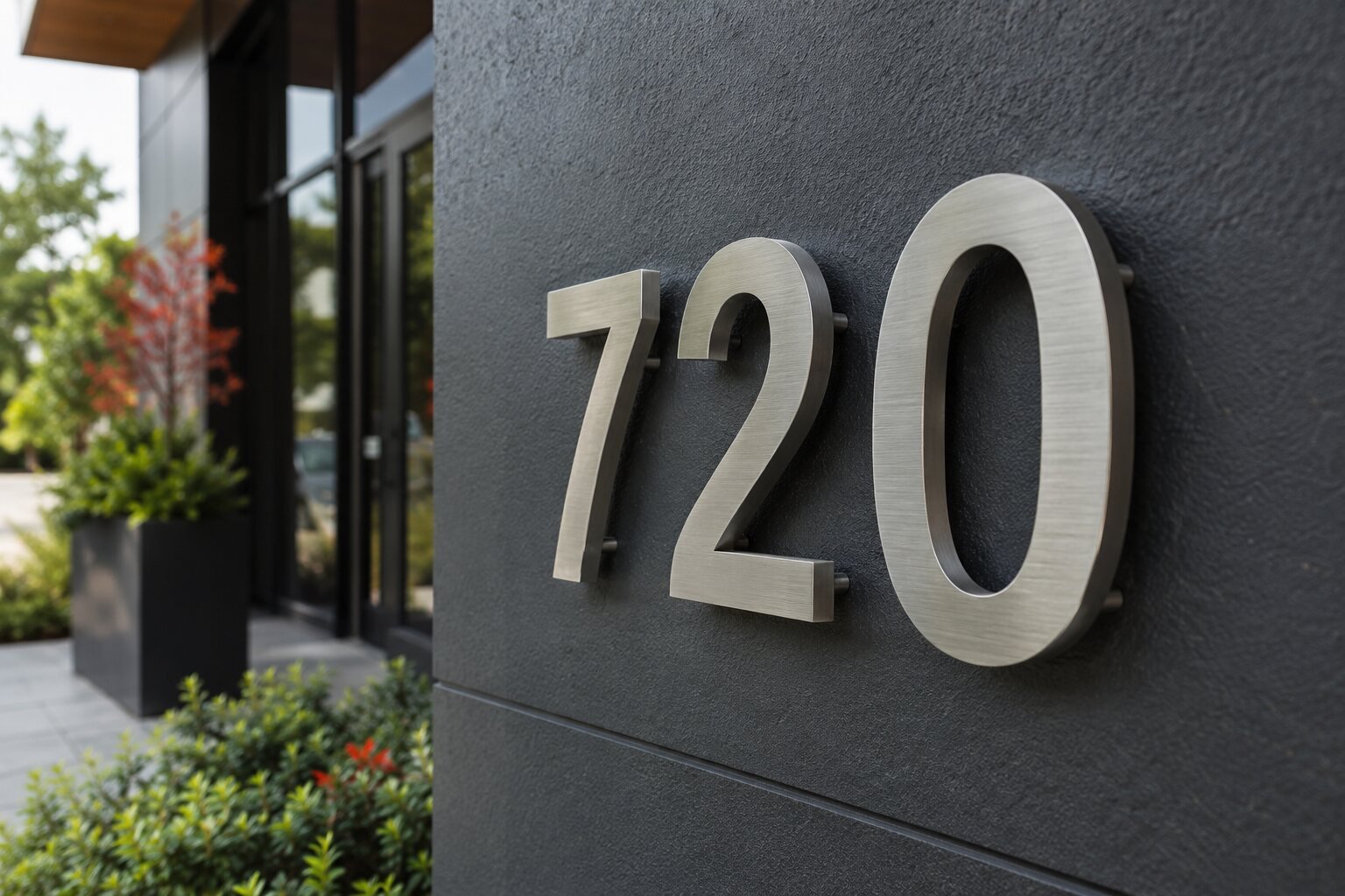 Close detail of precision fabricated address numerals and mounting hardware