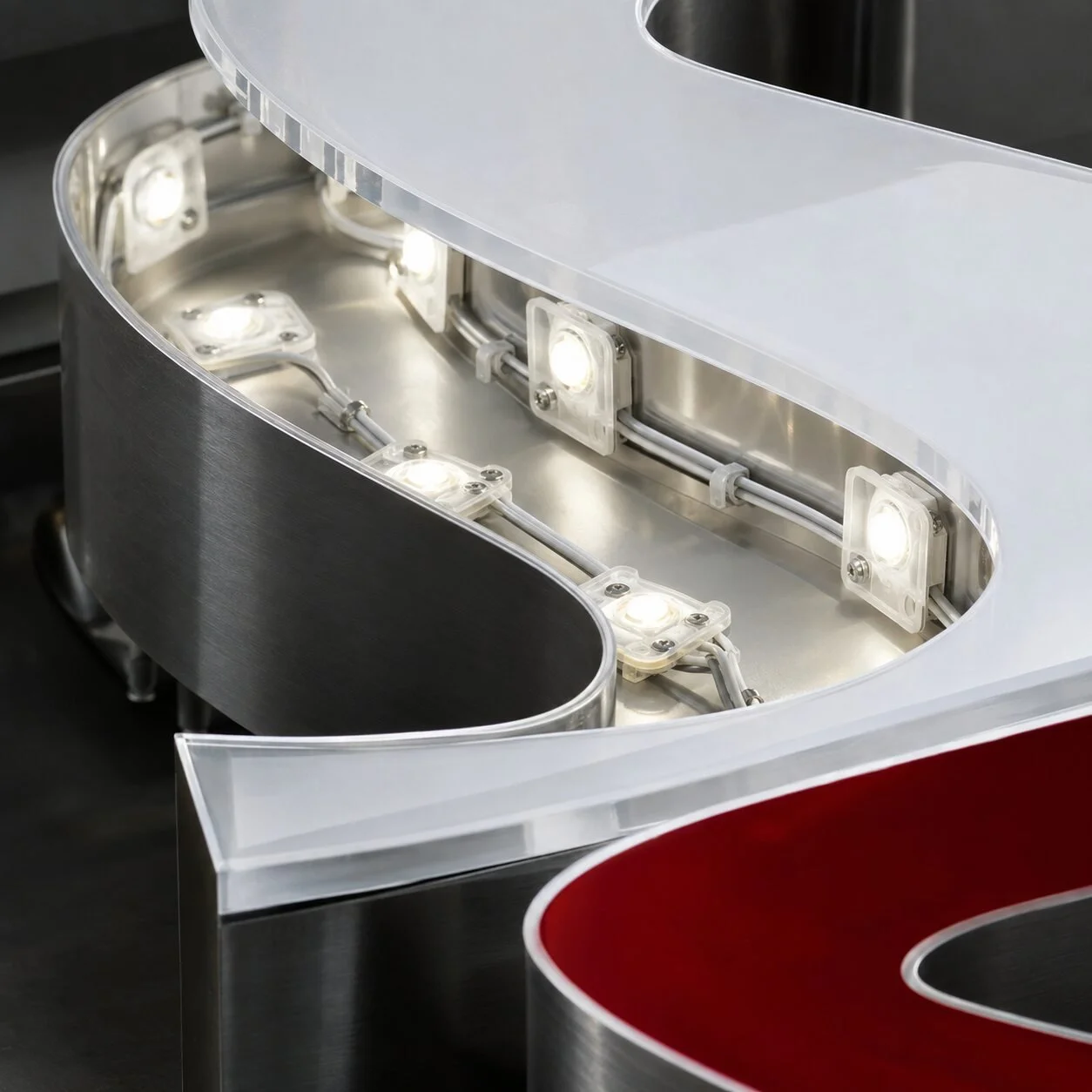 Close detail of LED modules and wiring inside an illuminated sign