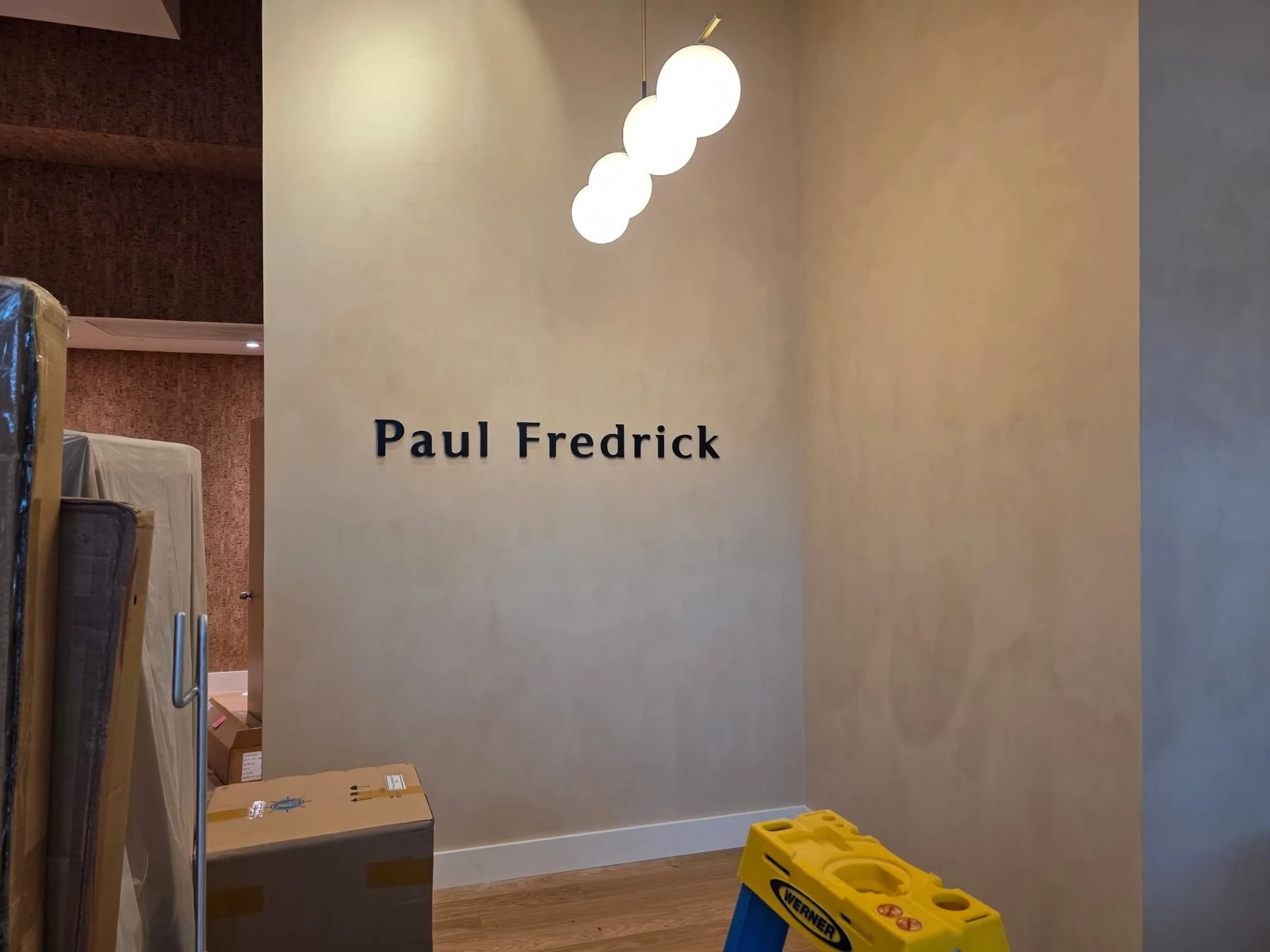 Paul Fredrick dimensional letters installed on an office feature wall