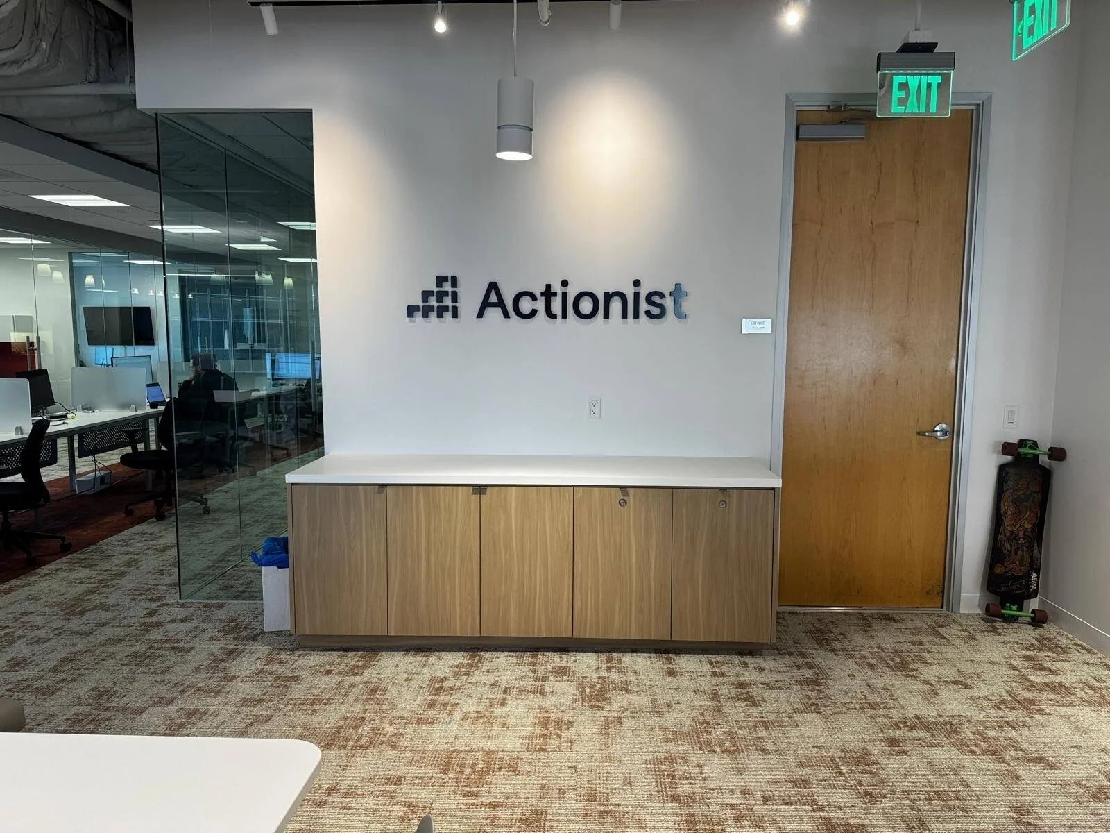 Actionist dimensional logo installed in a modern office reception area