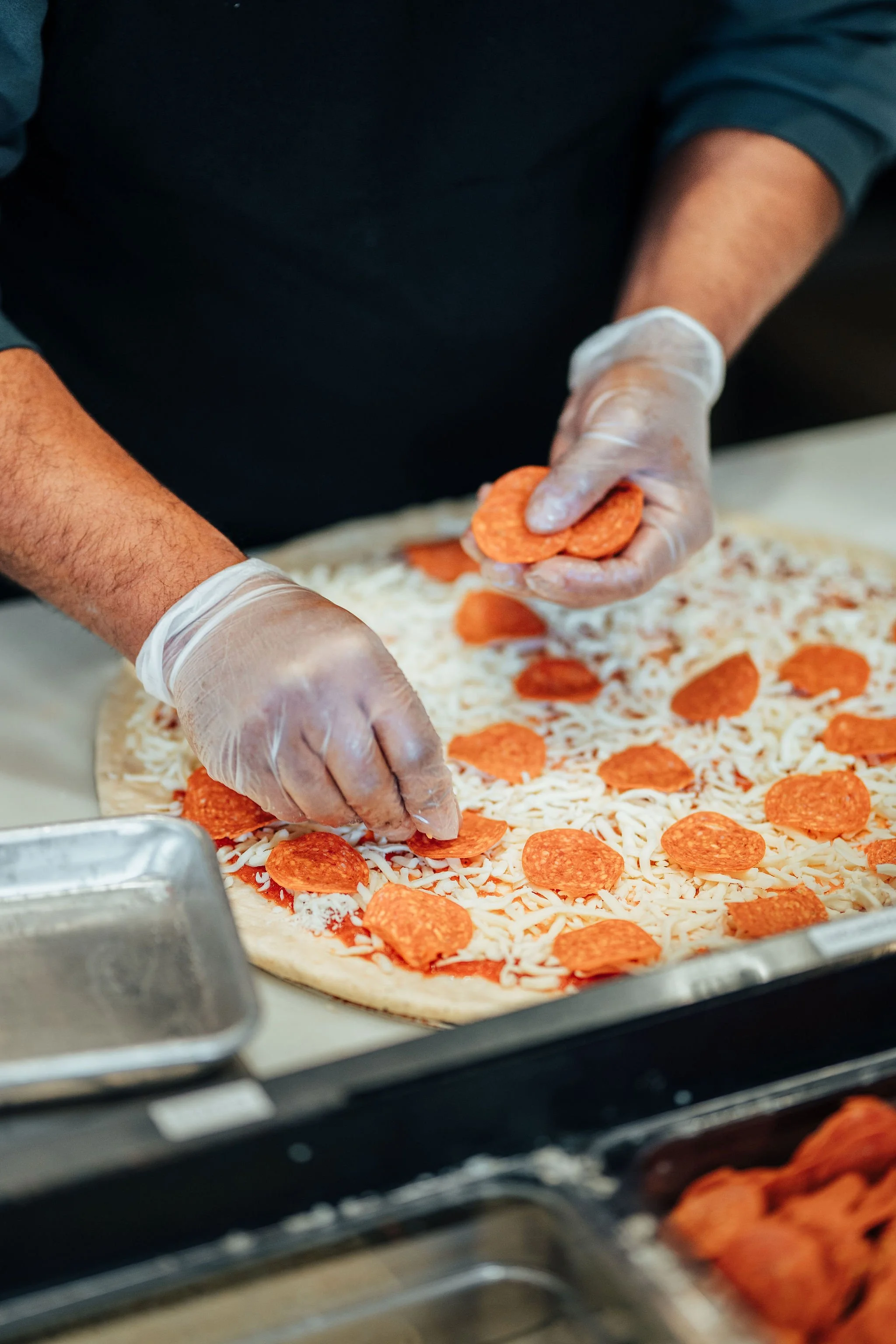 Pizza being prepped at Mikey's Late Night Slice