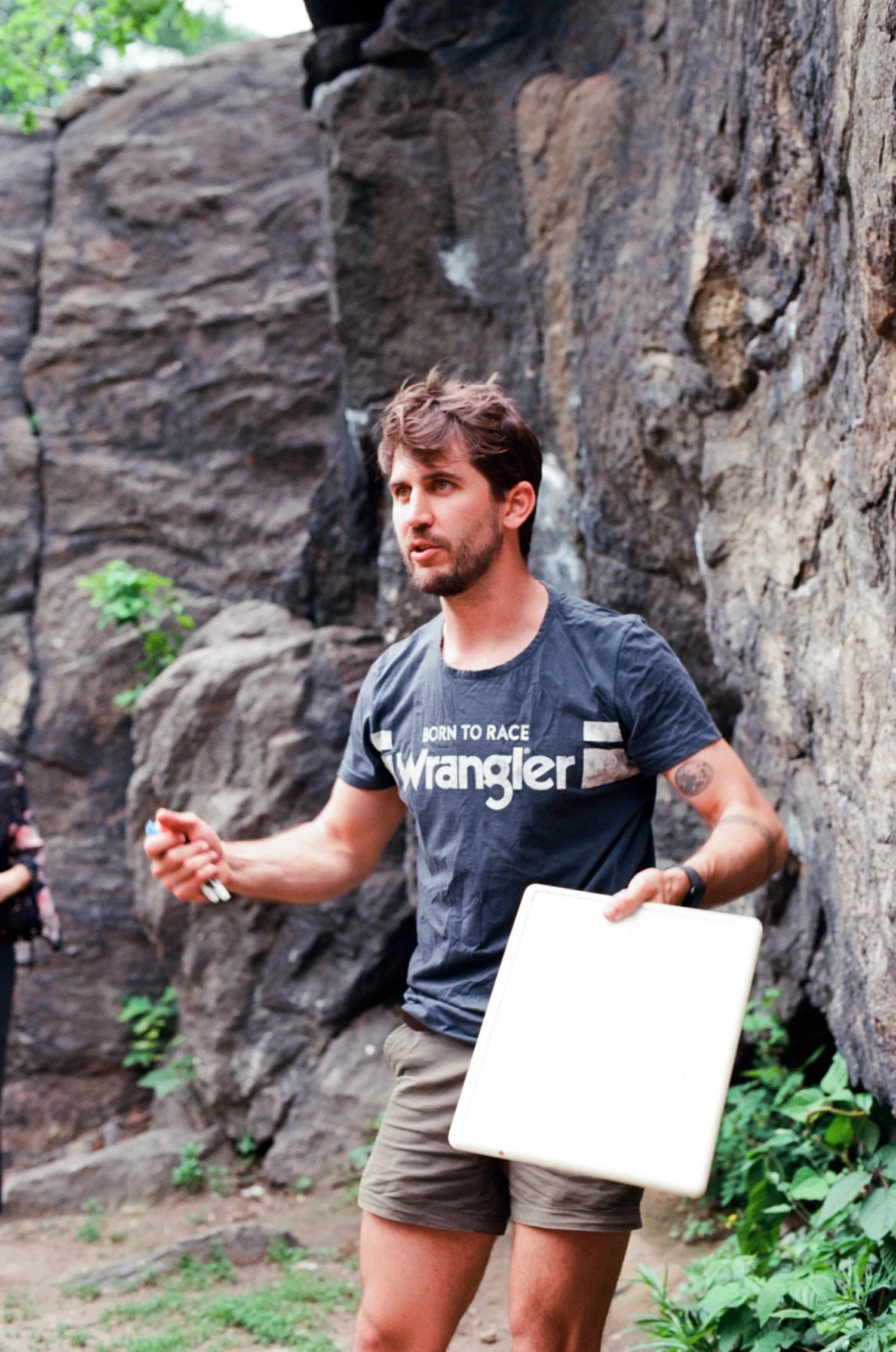 Dan explaining geology outdoors, in black and white