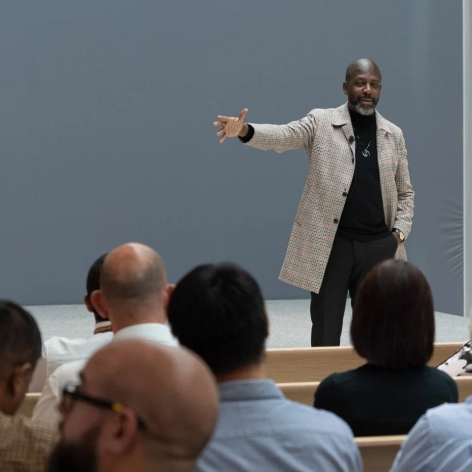 David McQueen speaking on stage