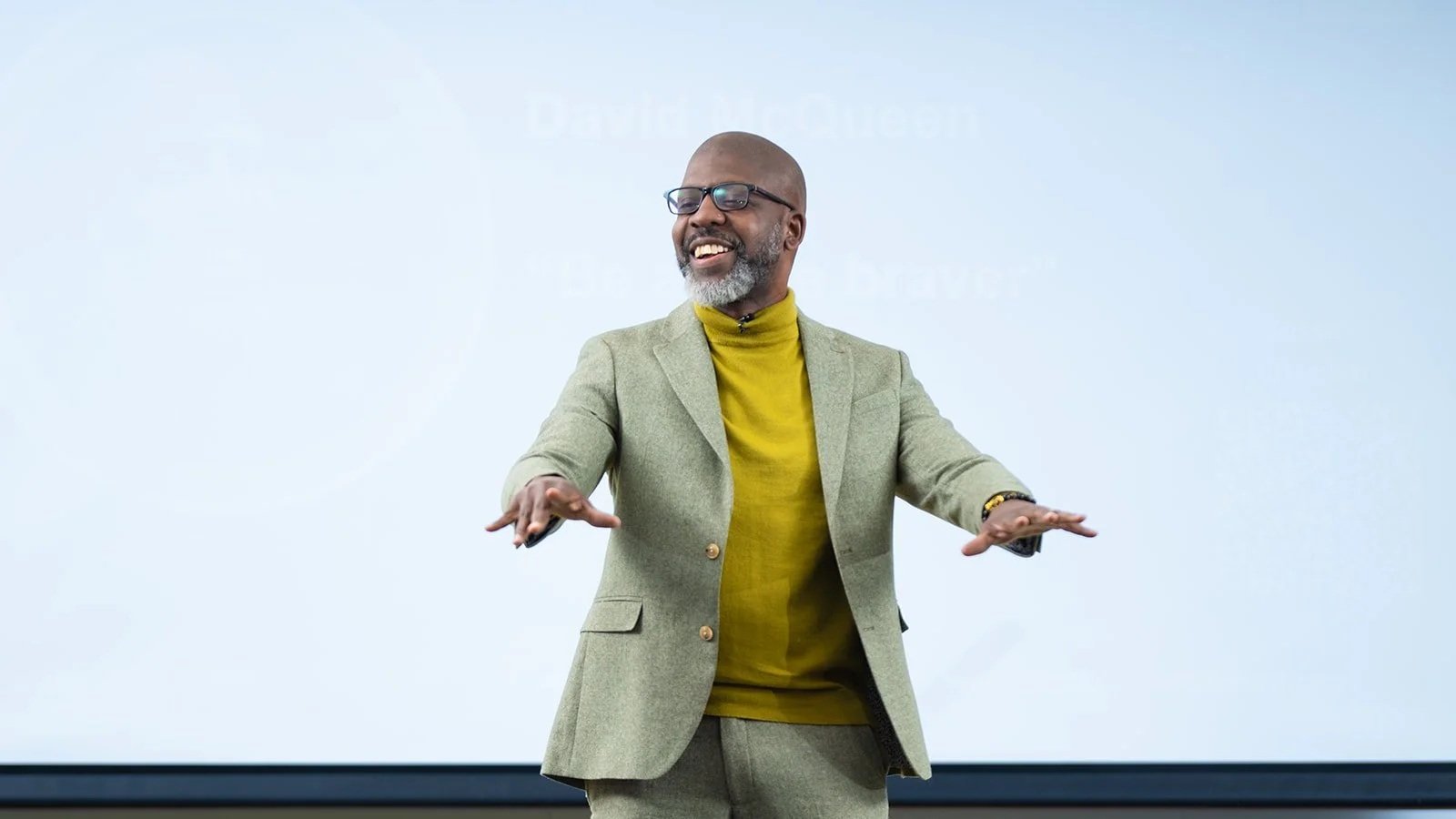 David McQueen speaking on stage