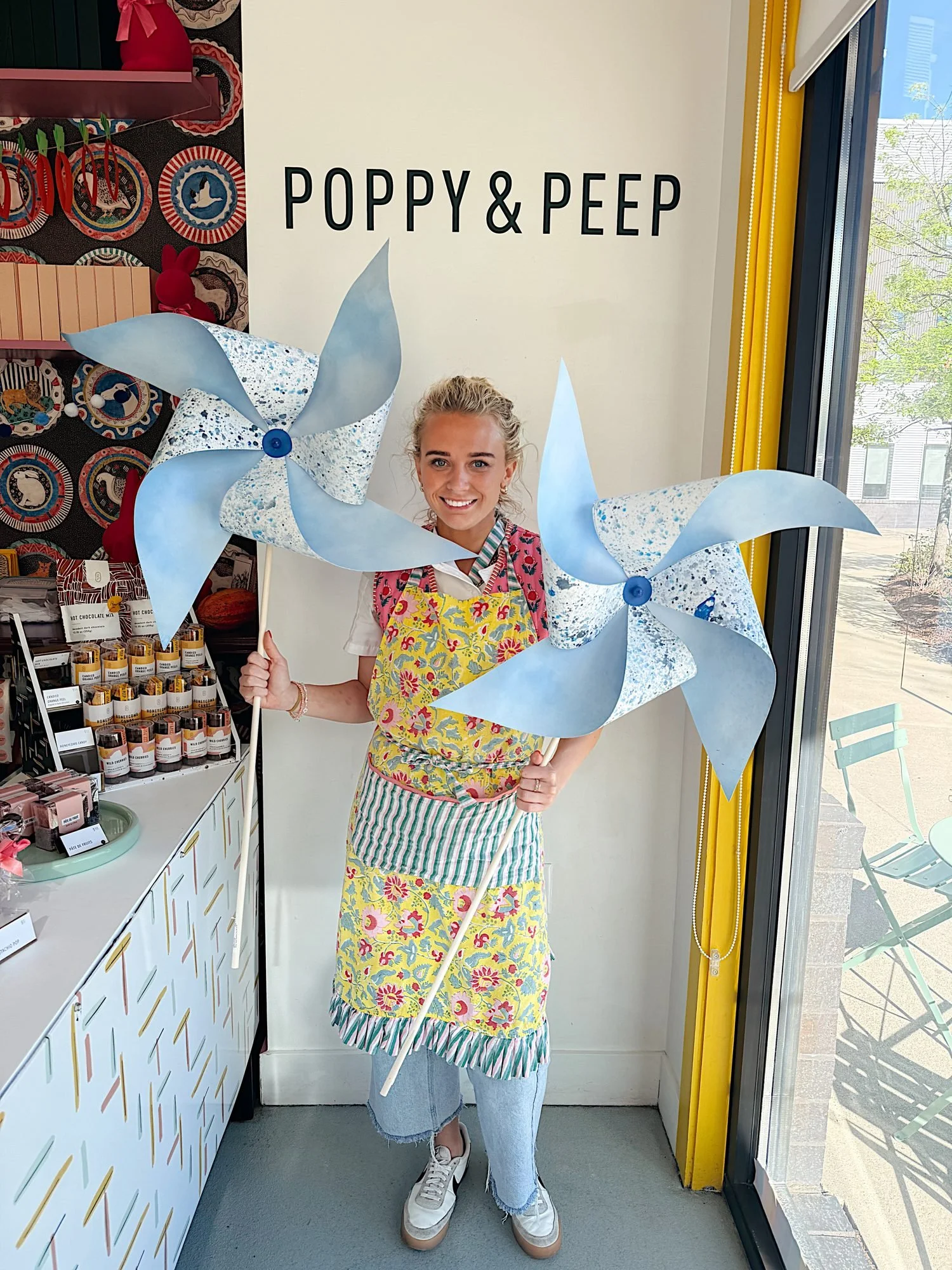 Evane holding pinwheels at Poppy and Peep