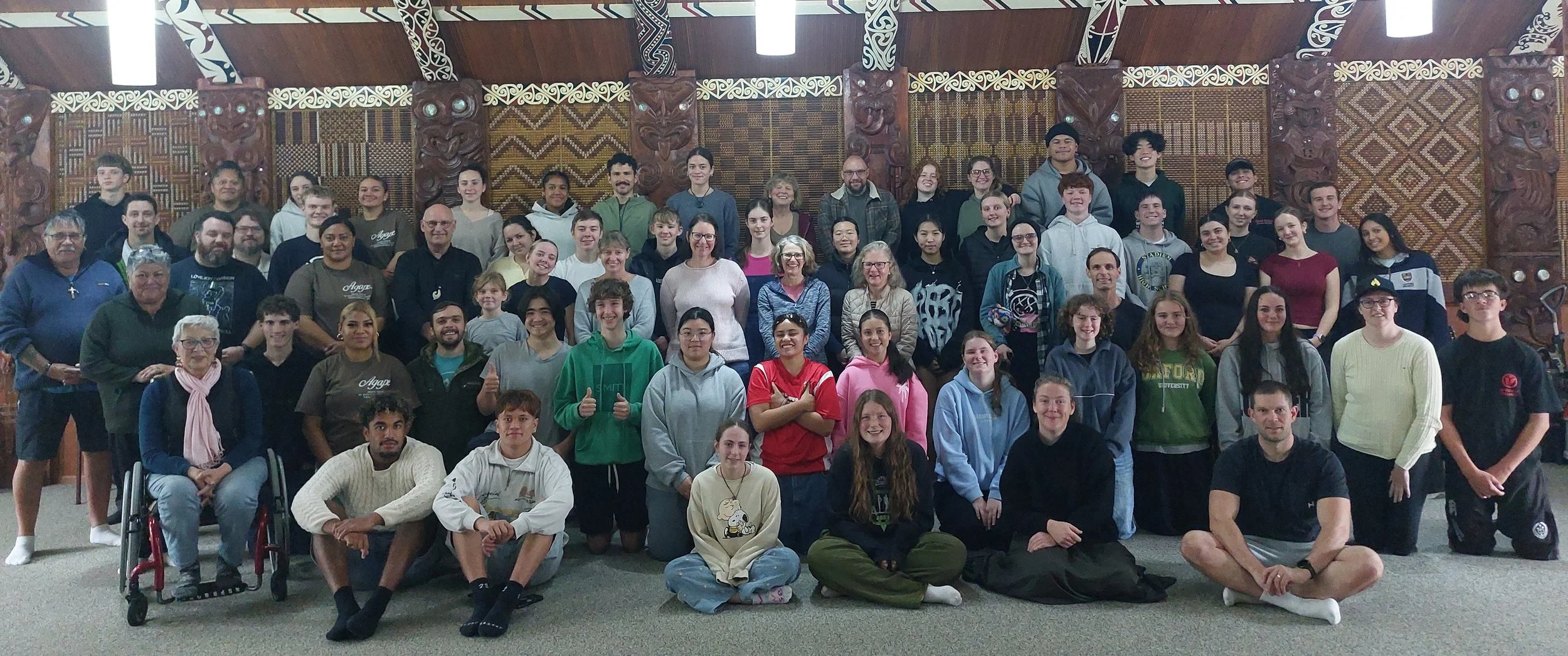 Rangatahi and leaders gathered inside the wharenui at Te Maungarongo Marae, 2026