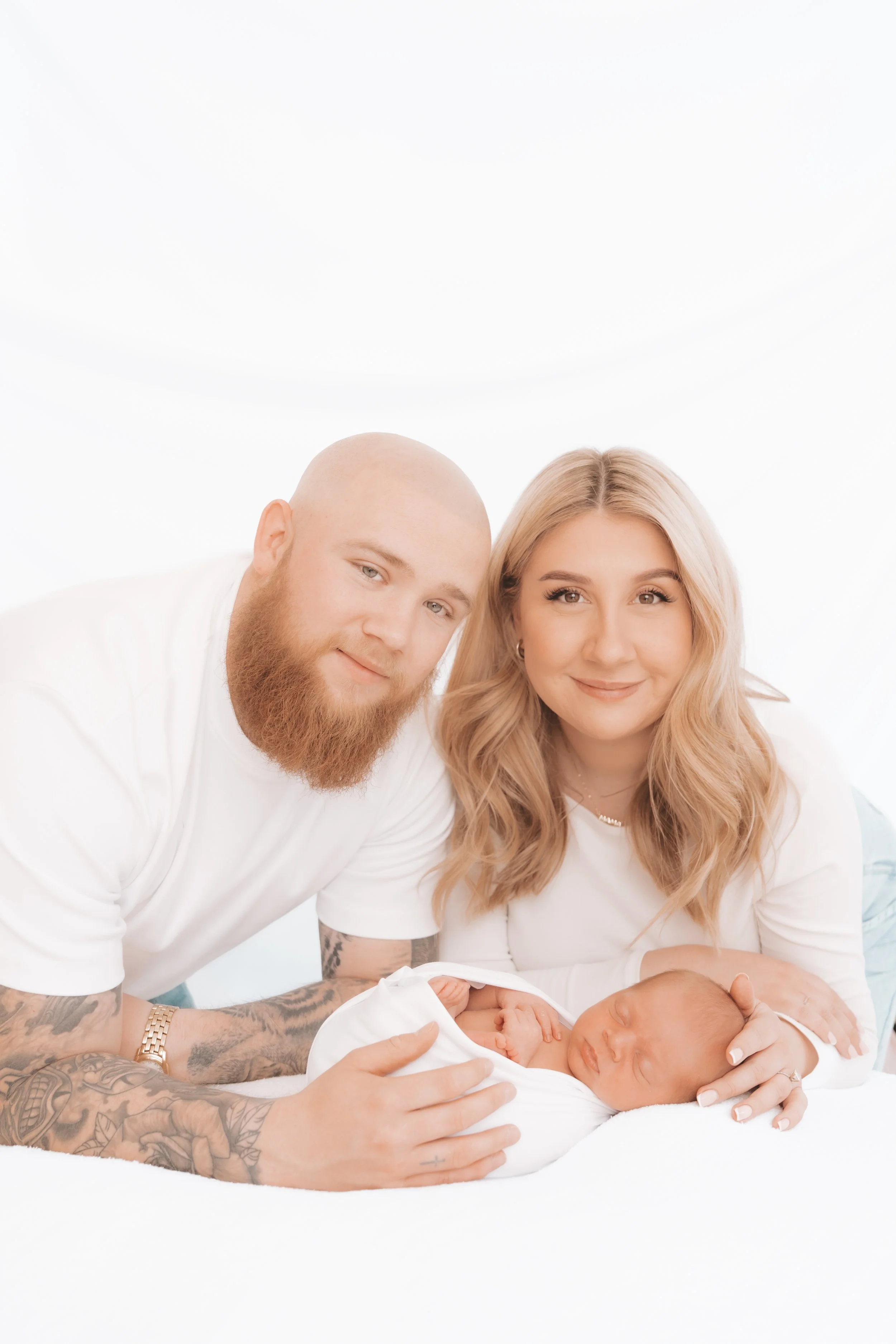Parents holding their newborn