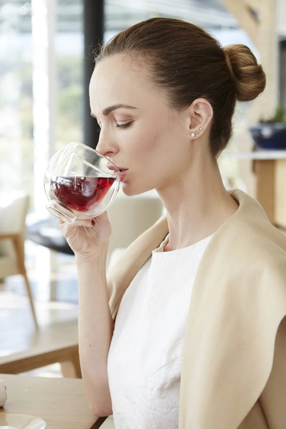 Guest sipping wine at Gate