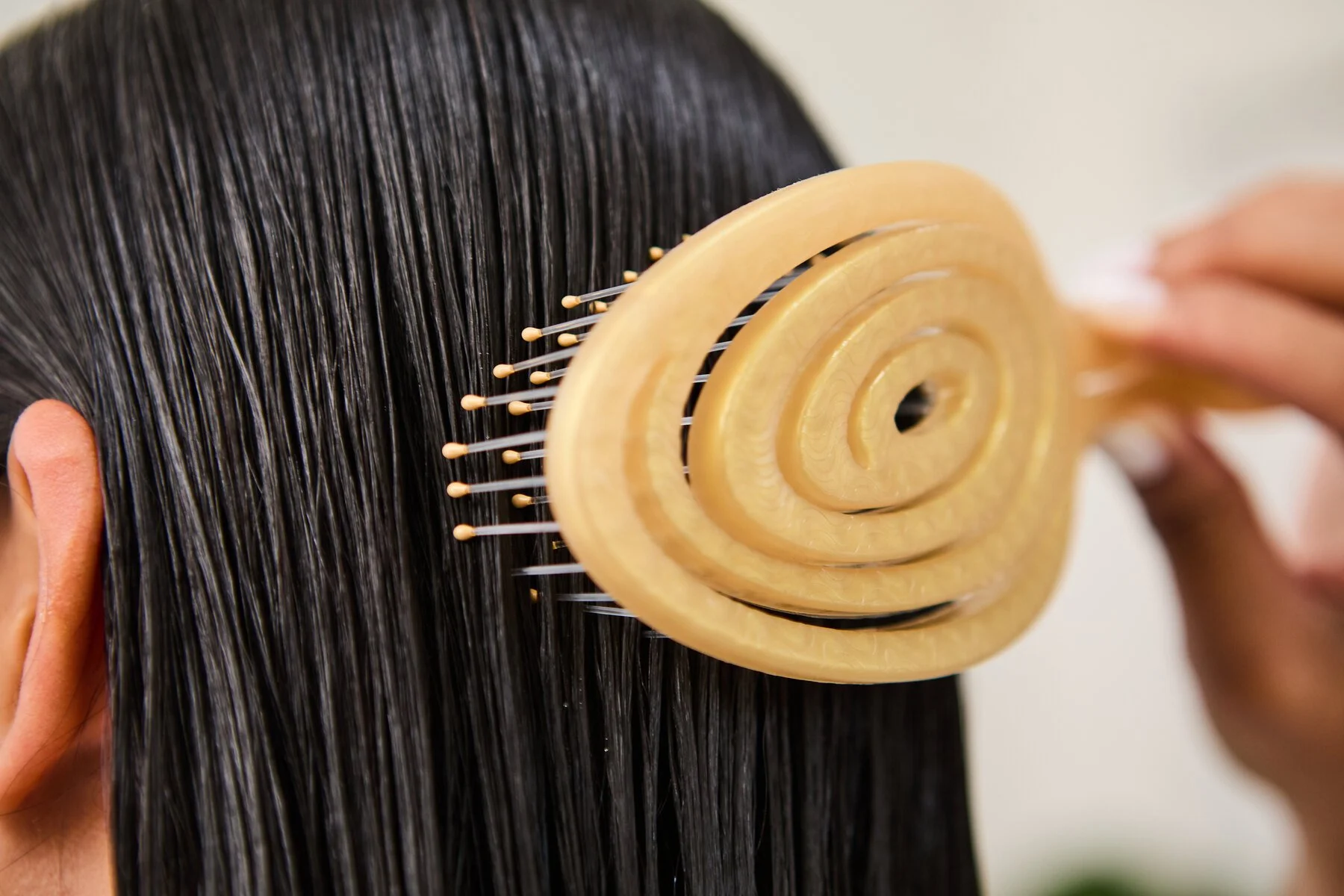 A Ninabella brush gliding through hair without tugging
