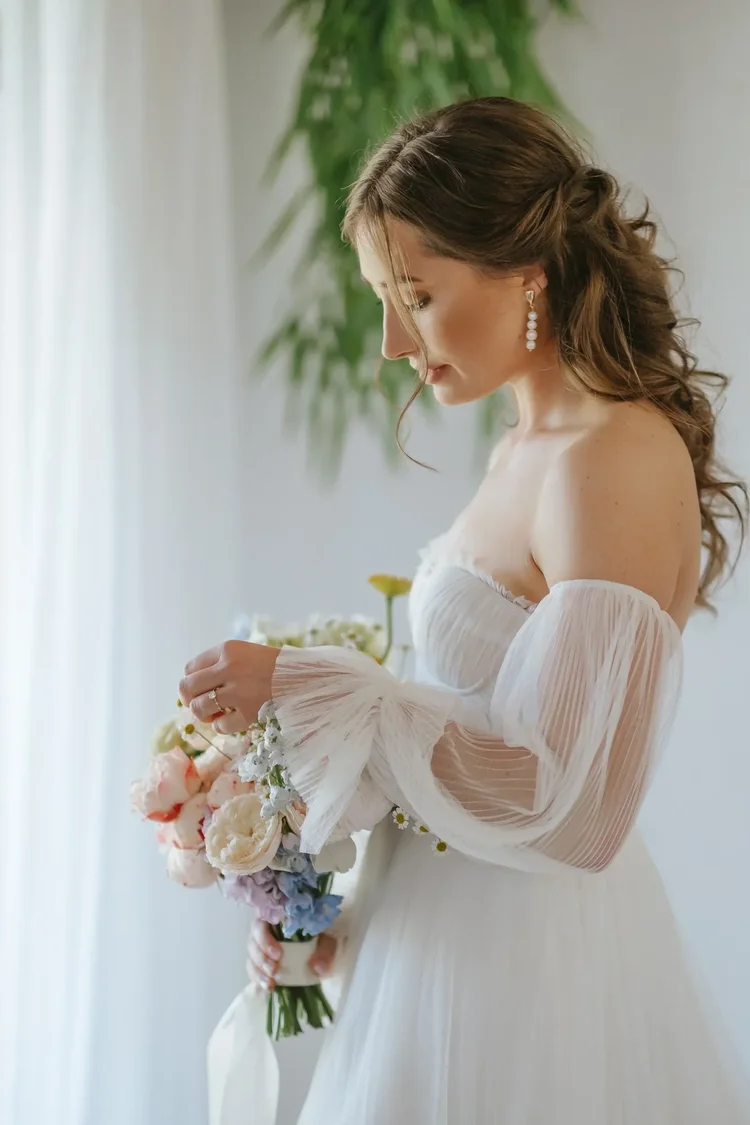 Editorial portrait of a bride holding her bouquet