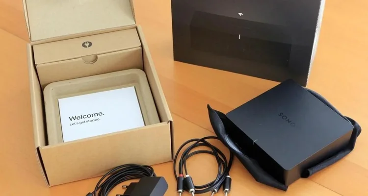 Sonos Port audio component, cables and packaging ready for professional outdoor audio installation