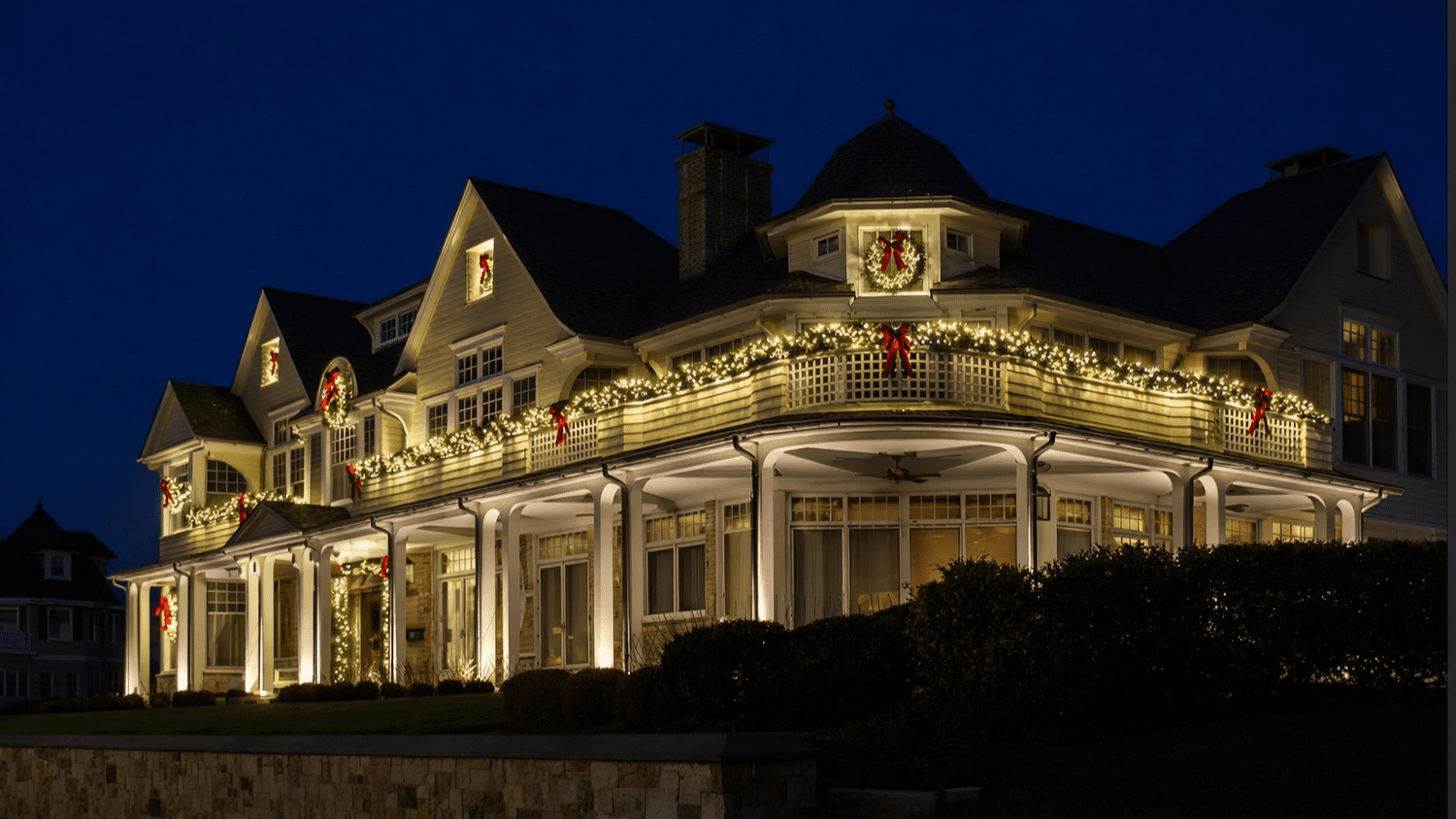 Custom holiday lighting designed around the architecture of a large New Jersey home