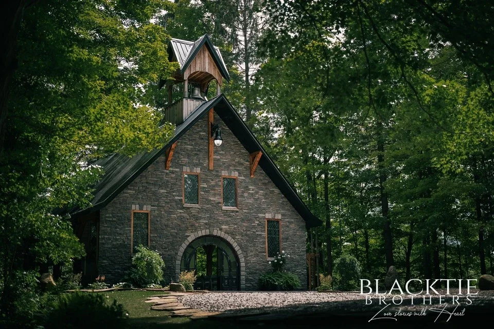 The stone Chapel in the Woods at Graceful Gatherings at LedgeRock, seen from the approach path.