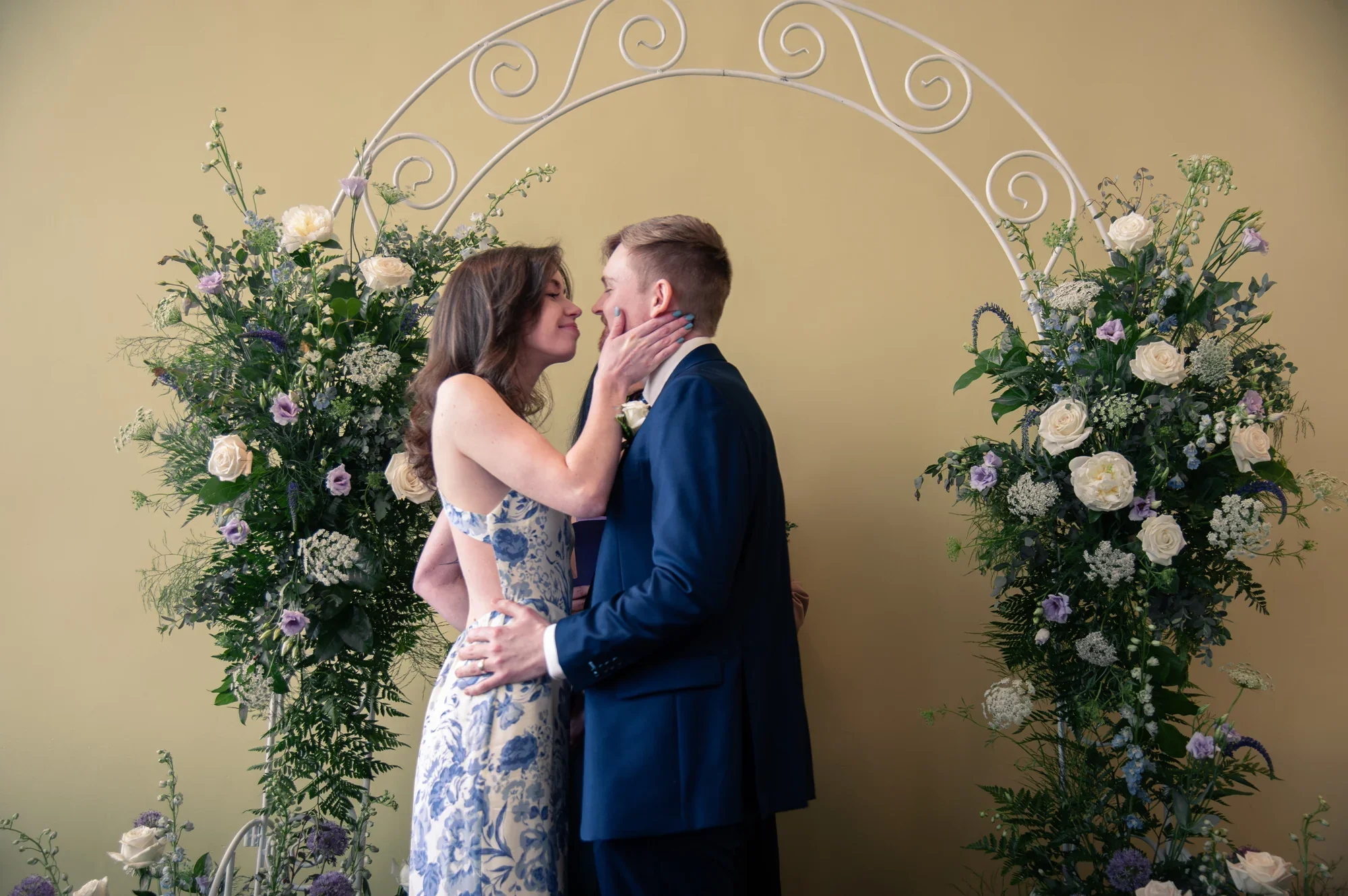 Kealy and Jimmy together beneath their ceremony arch at Remlik’s.