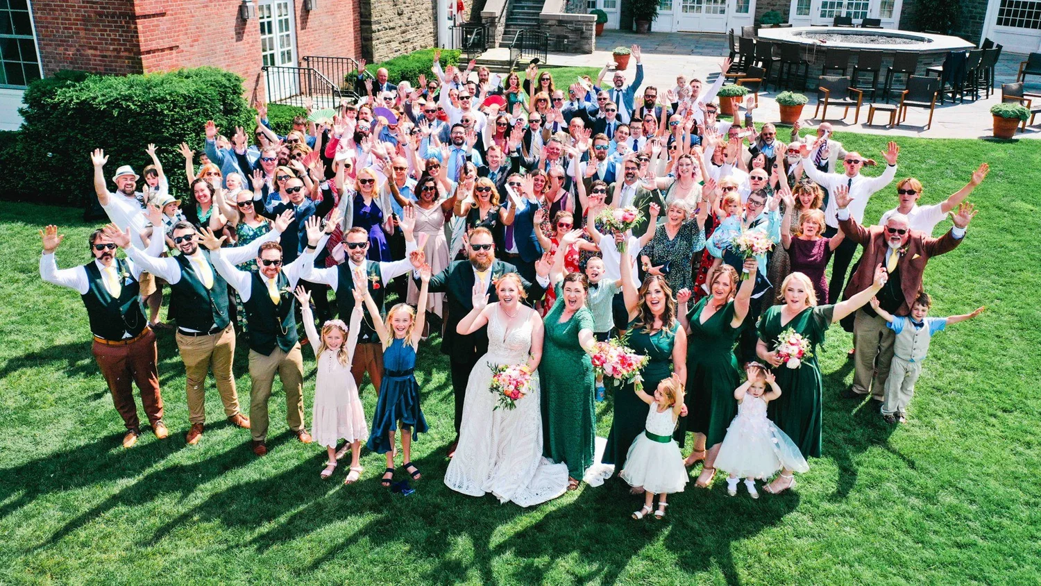Amanda and Chris celebrating with their guests on The Otesaga lawn