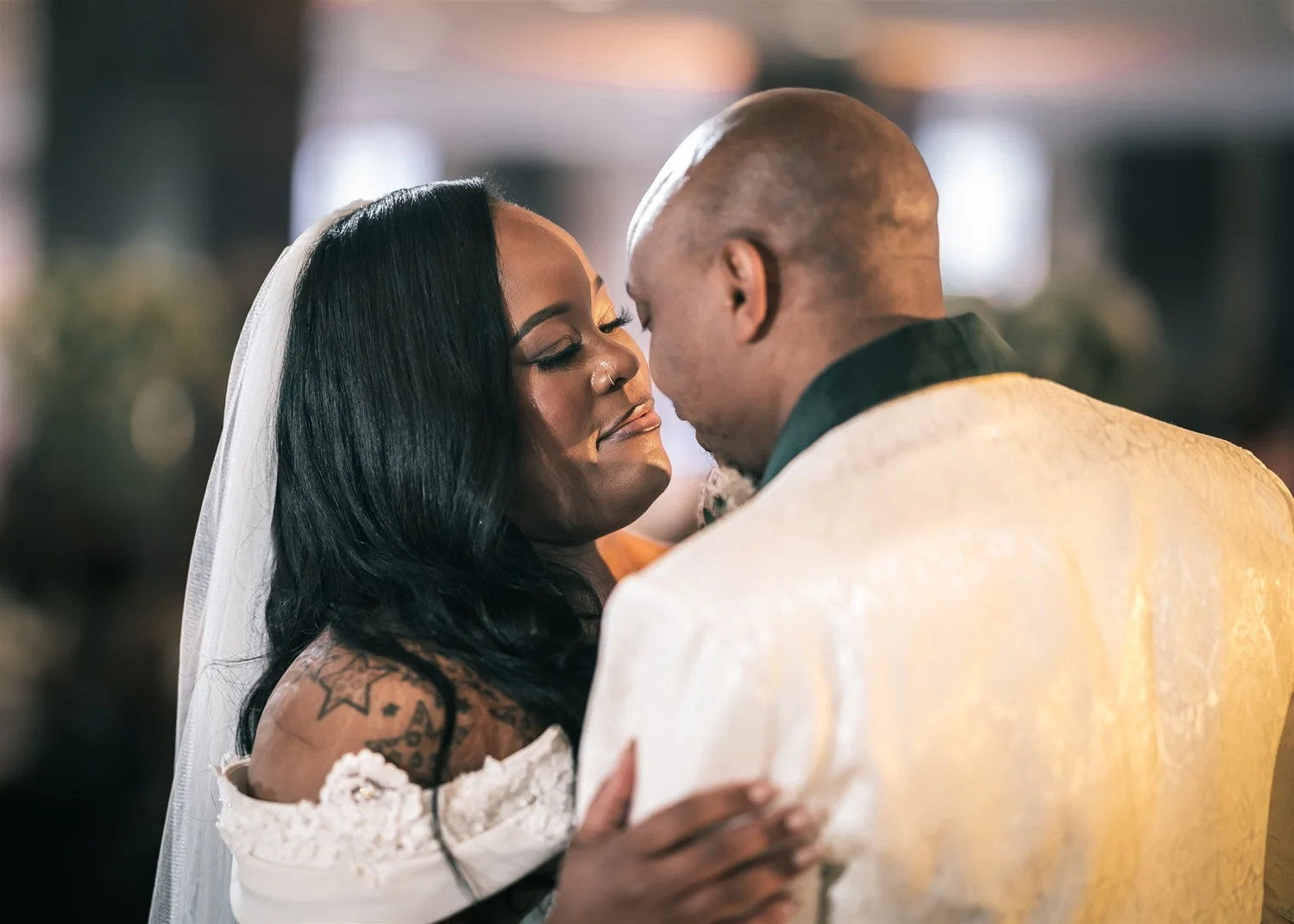 Tiffany and David hold each other during their first dance.