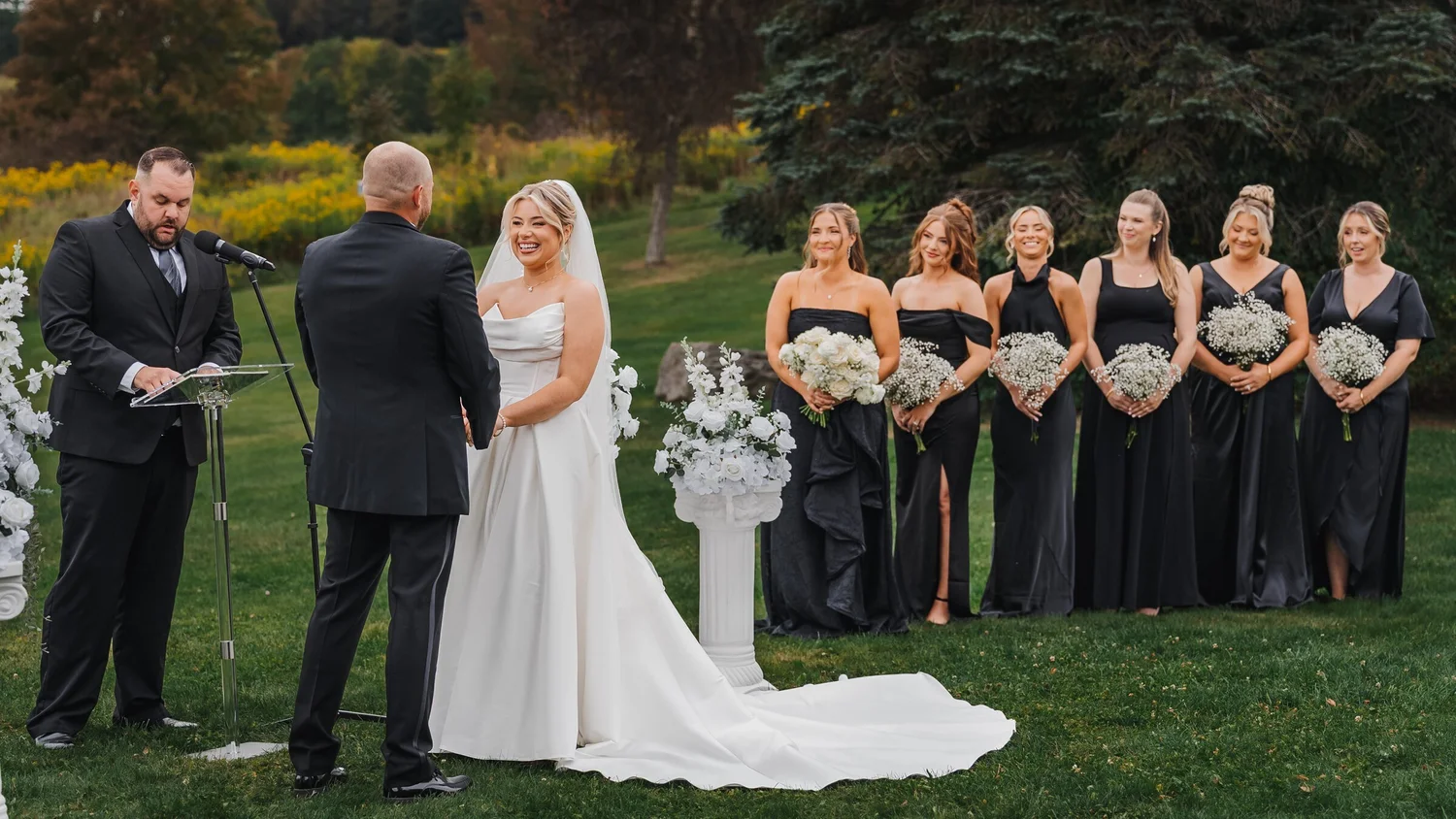Couple exchanging vows at Stonewall Estate's hilltop ceremony site