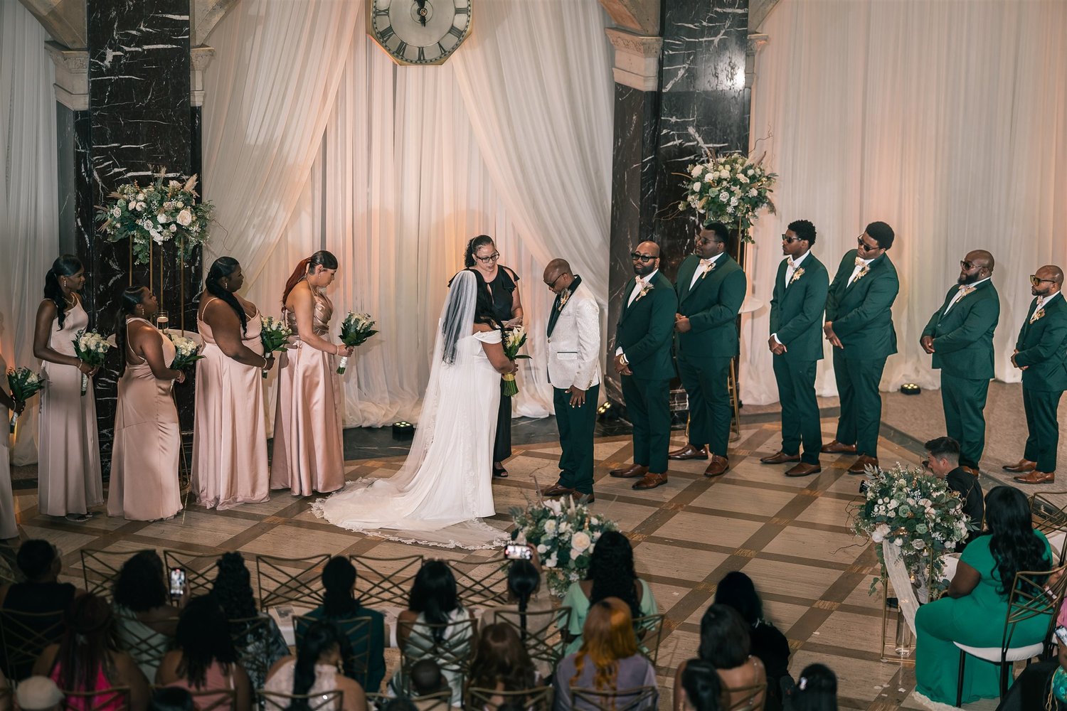 Tiffany and David during their ceremony, with their wedding party, photographed from above.