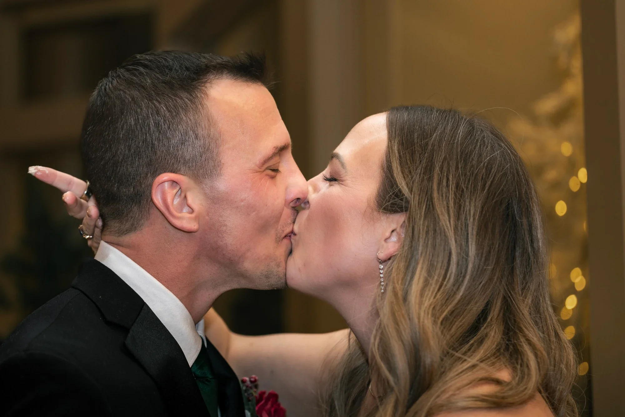 Mackenzie and David share a kiss after cutting the cake at Remlik’s.