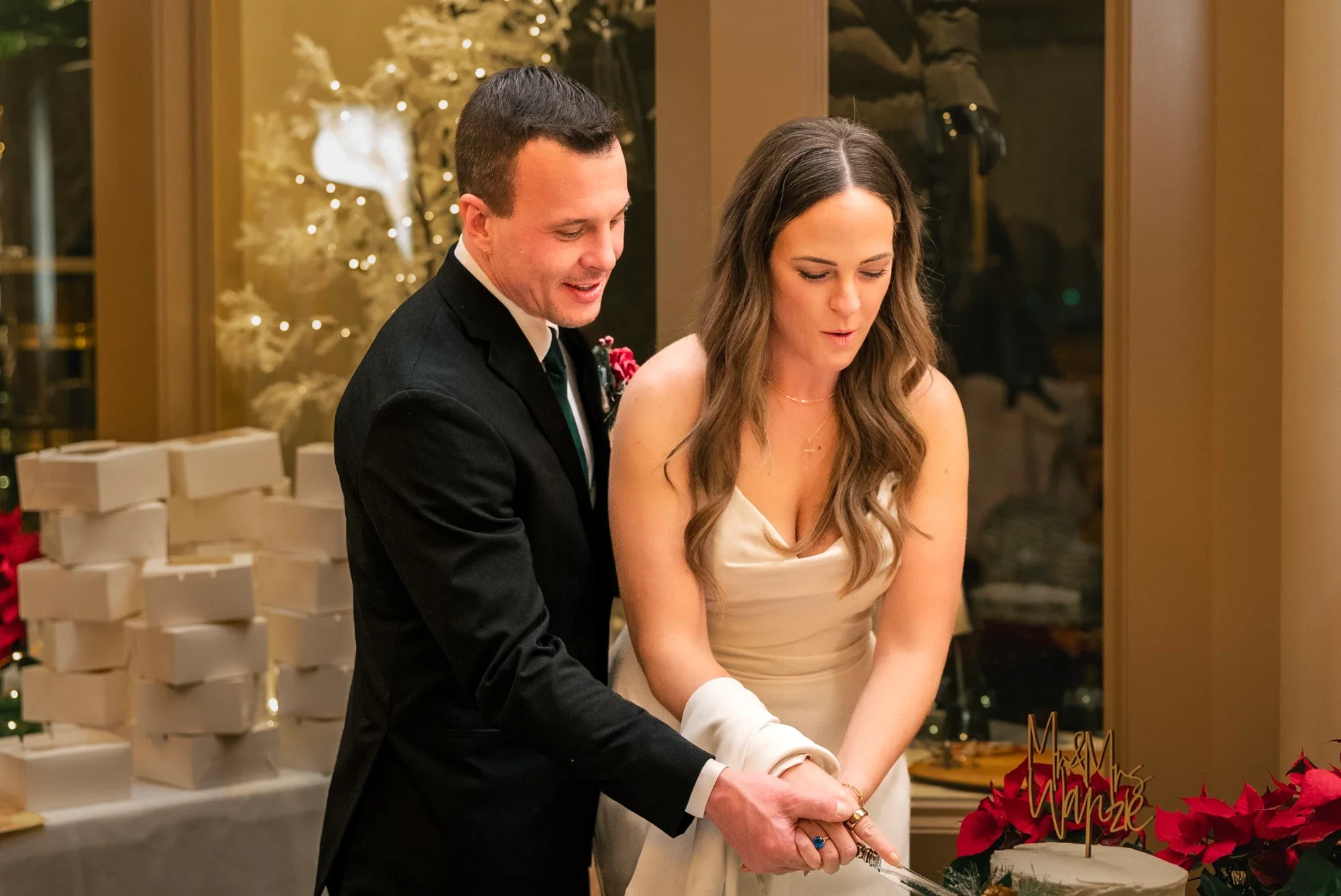Mackenzie and David cut their wedding cake in the Remlik’s dining room.