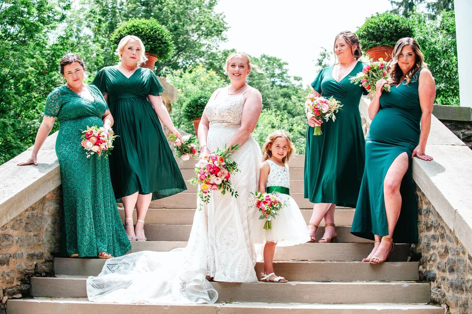 Amanda and her bridesmaids in green dresses at The Otesaga