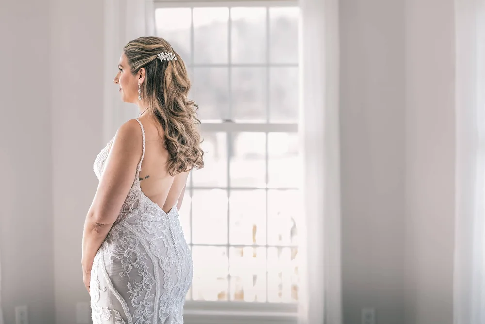 Window-light bridal portrait inside the Windham Manor House