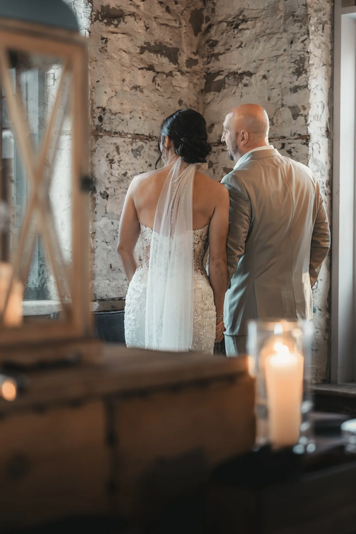 Jill and Nick reflected together in an antique mirror inside The Sinclair of Skaneateles