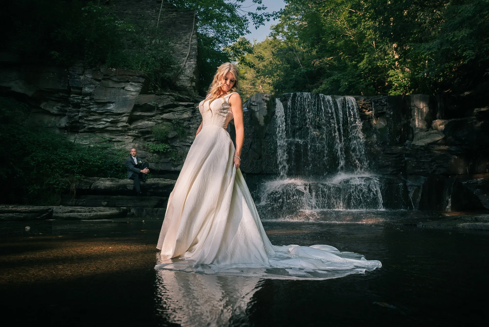 Couple photographed at the private waterfall on the LedgeRock grounds.