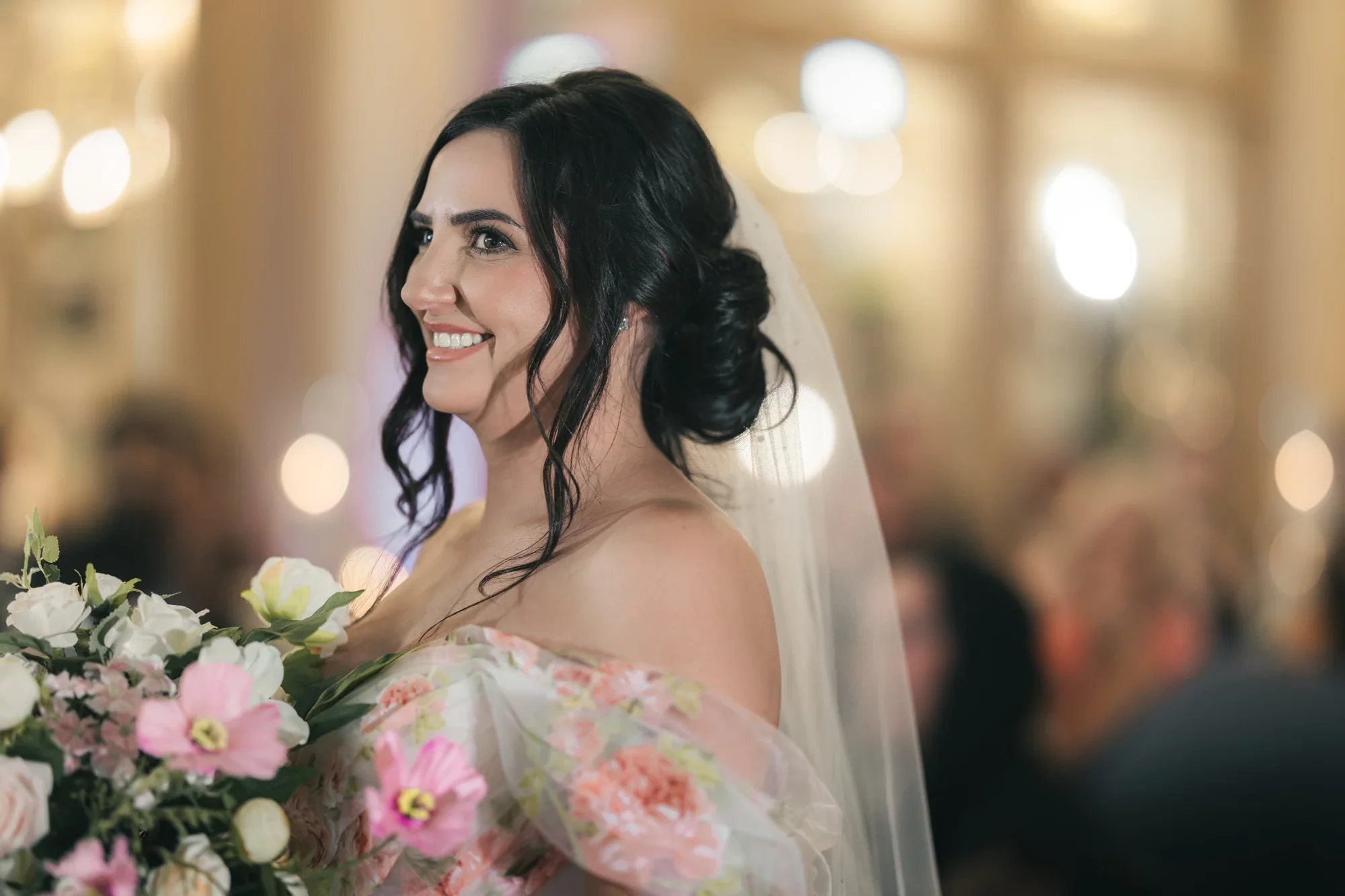 Melissa smiles with her bouquet during her Remlik’s wedding.