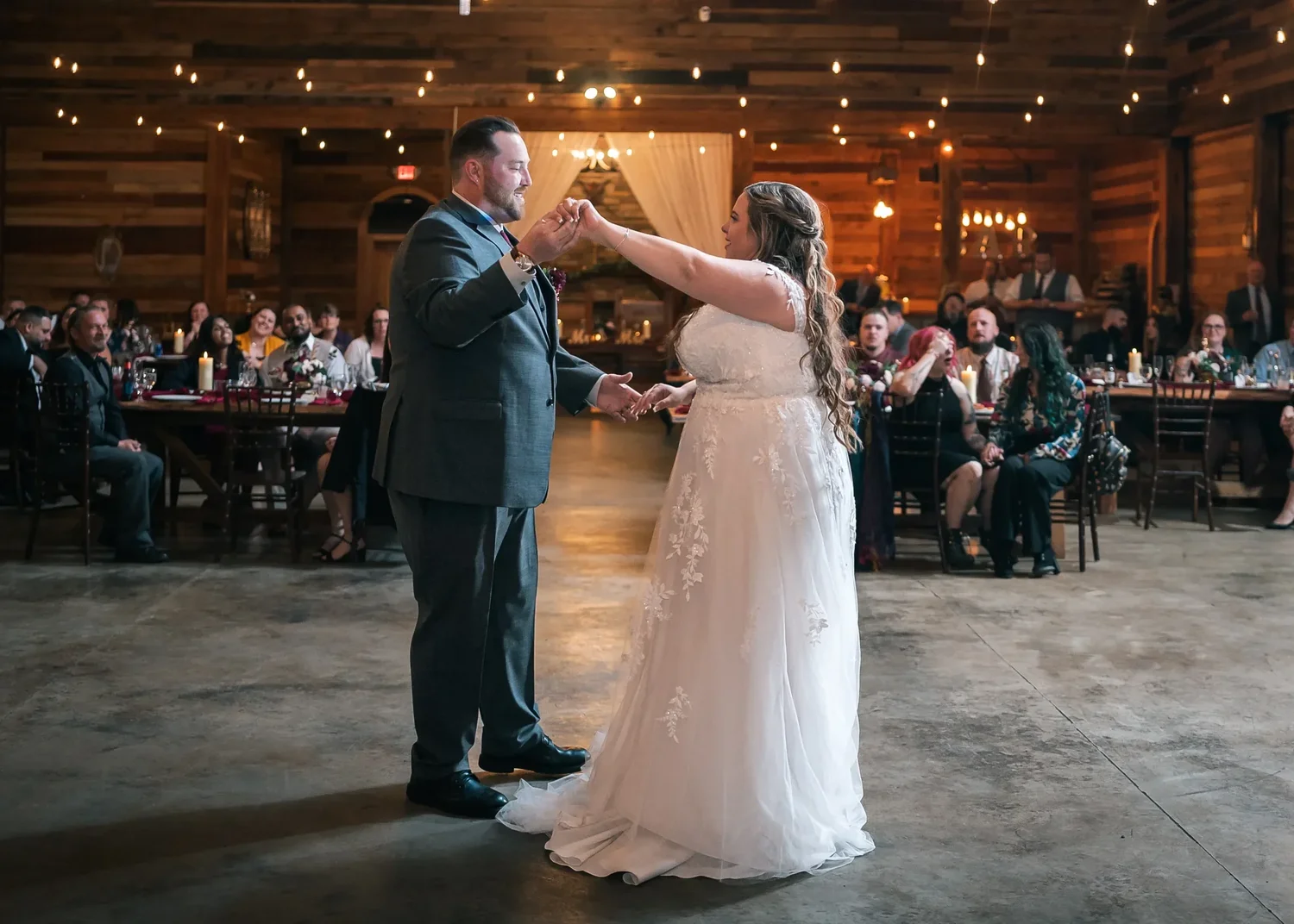 Newlyweds dancing inside the Stoney Creek Castle reception hall