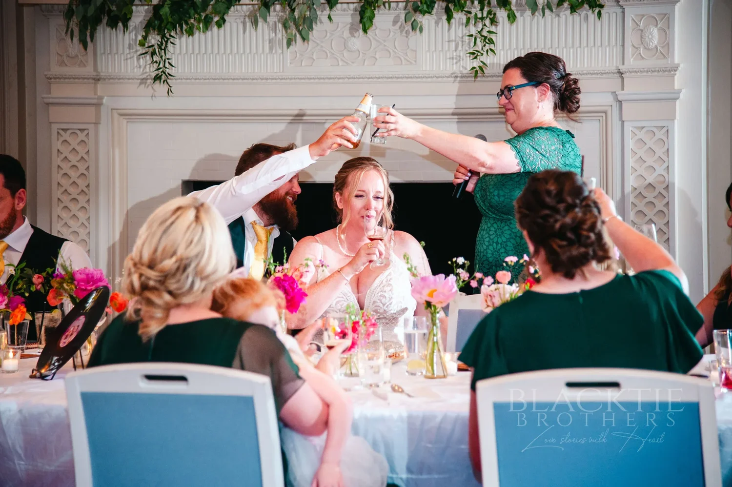 Guests raising a toast at Amanda and Chris’s reception at The Otesaga