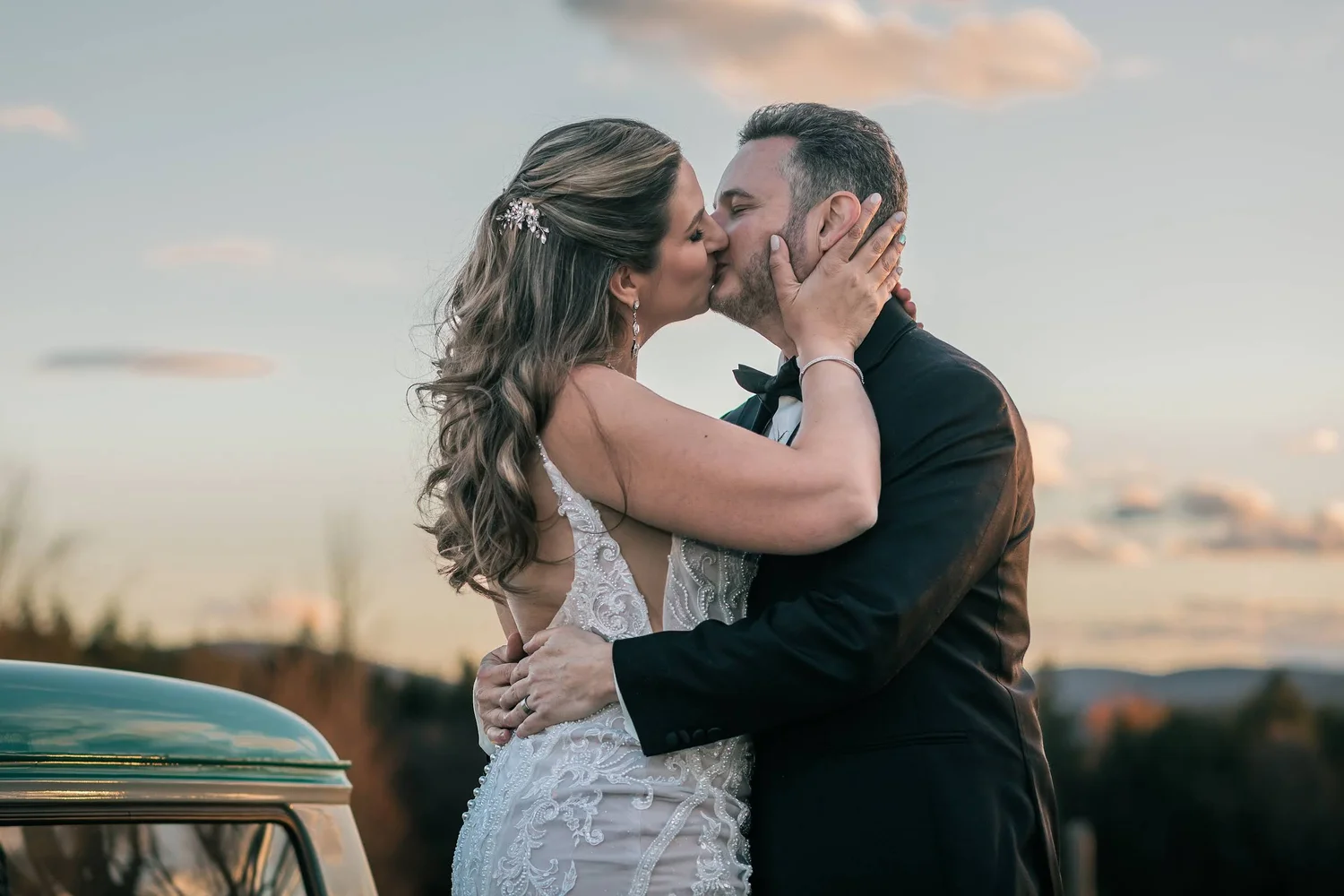 Charissa and Andrew sharing a sunset kiss at Windham Manor