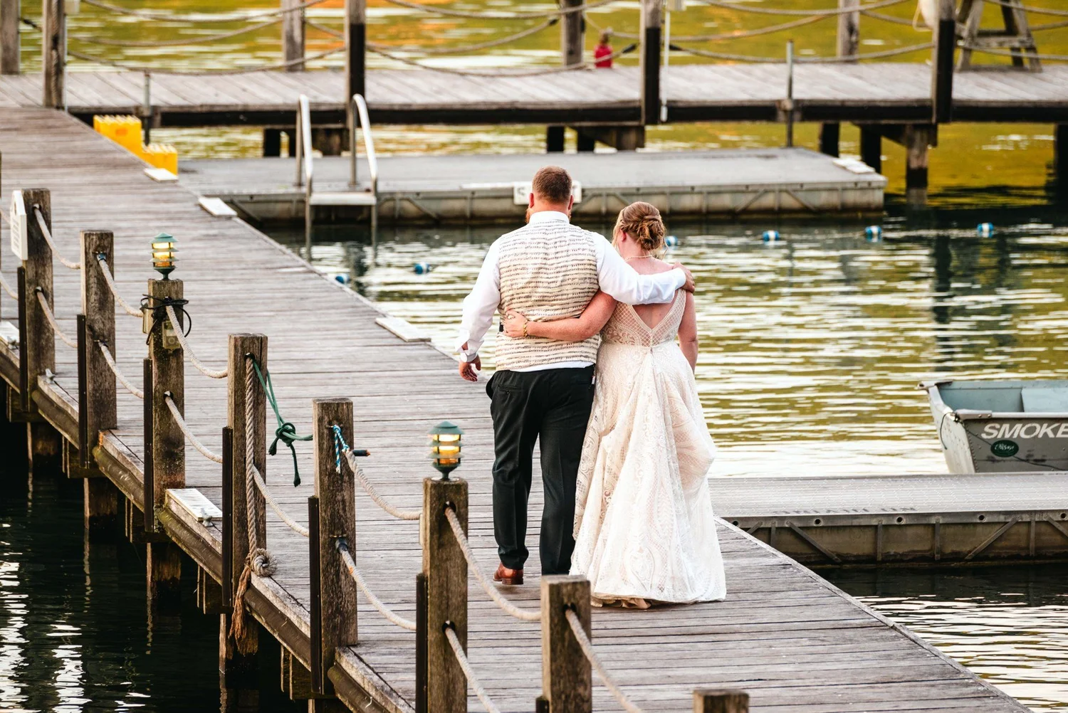 Amanda and Chris together on a dock beside Otsego Lake