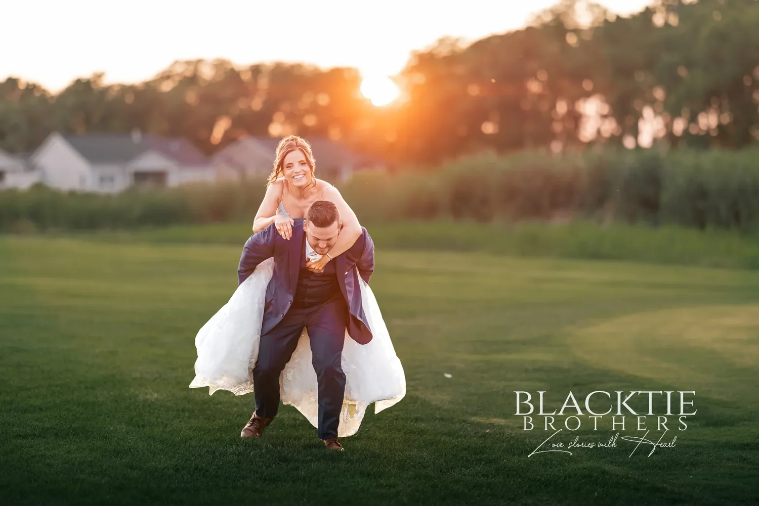 Jake carrying Taylor on his back across the fairway at sunset, both laughing, the sun setting through the trees behind them