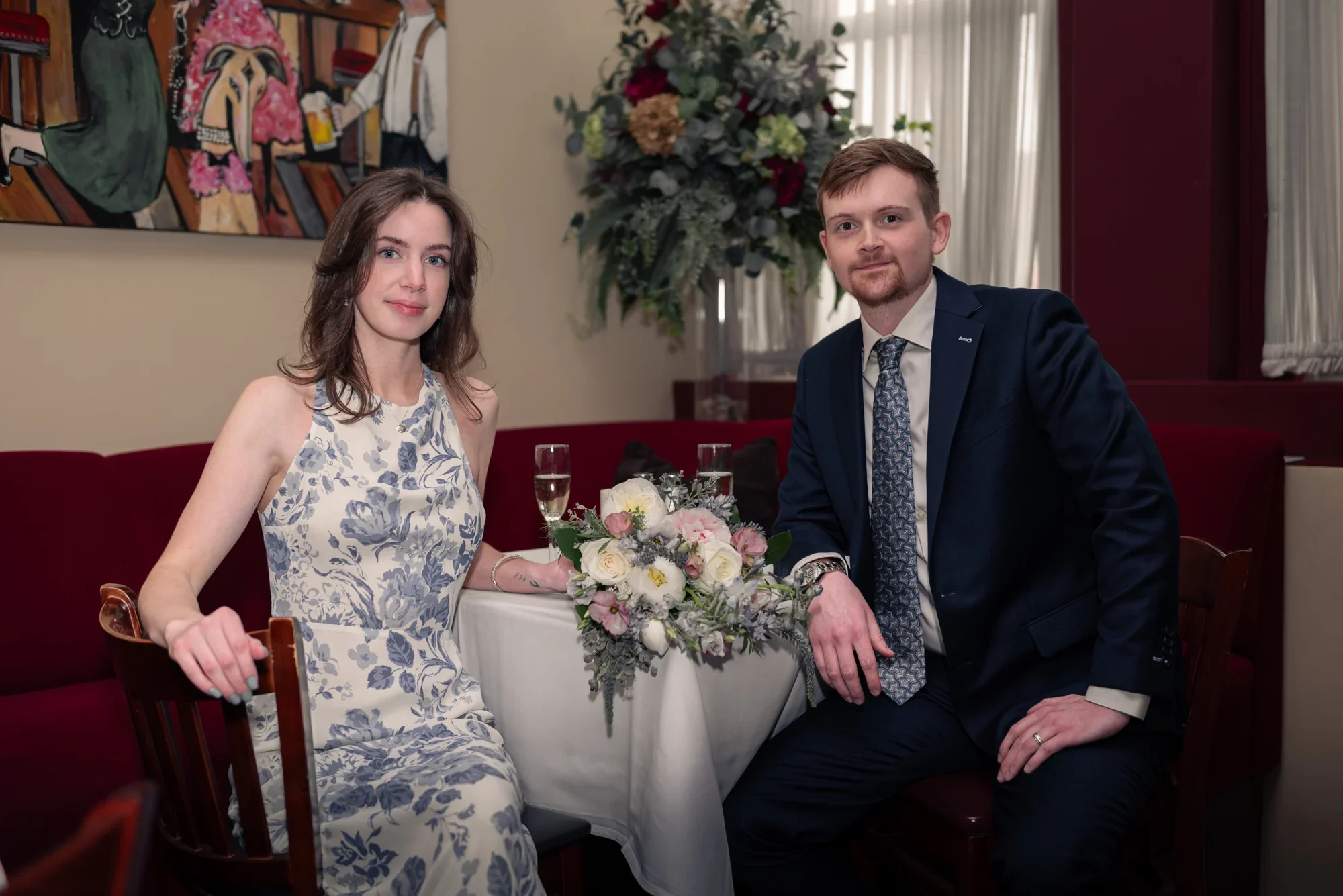 Kealy and Jimmy seated together in the Remlik’s dining room.