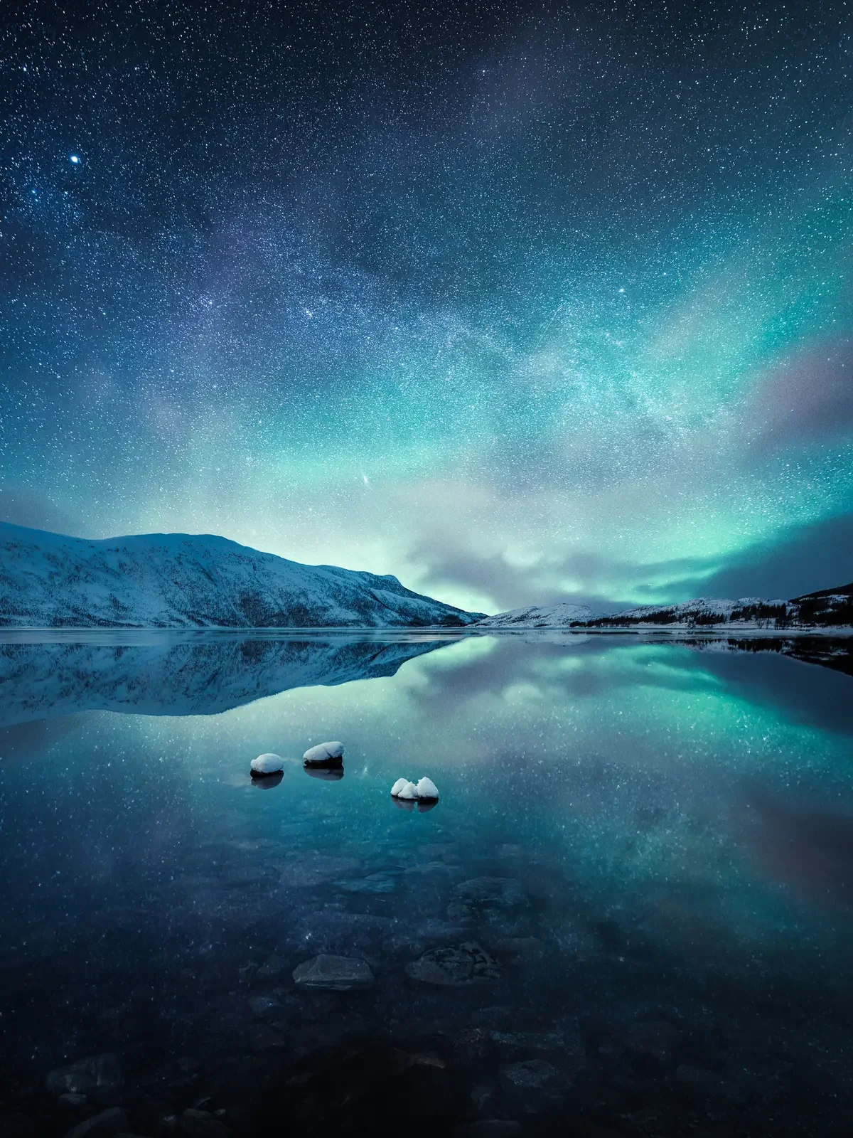 Shallow Water, a calm northern lake reflecting mountains and sky