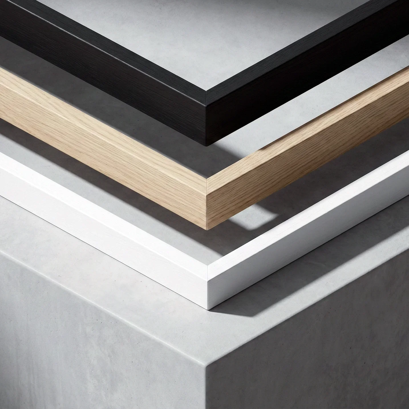 Comparison of black, oak, and white wooden picture frames